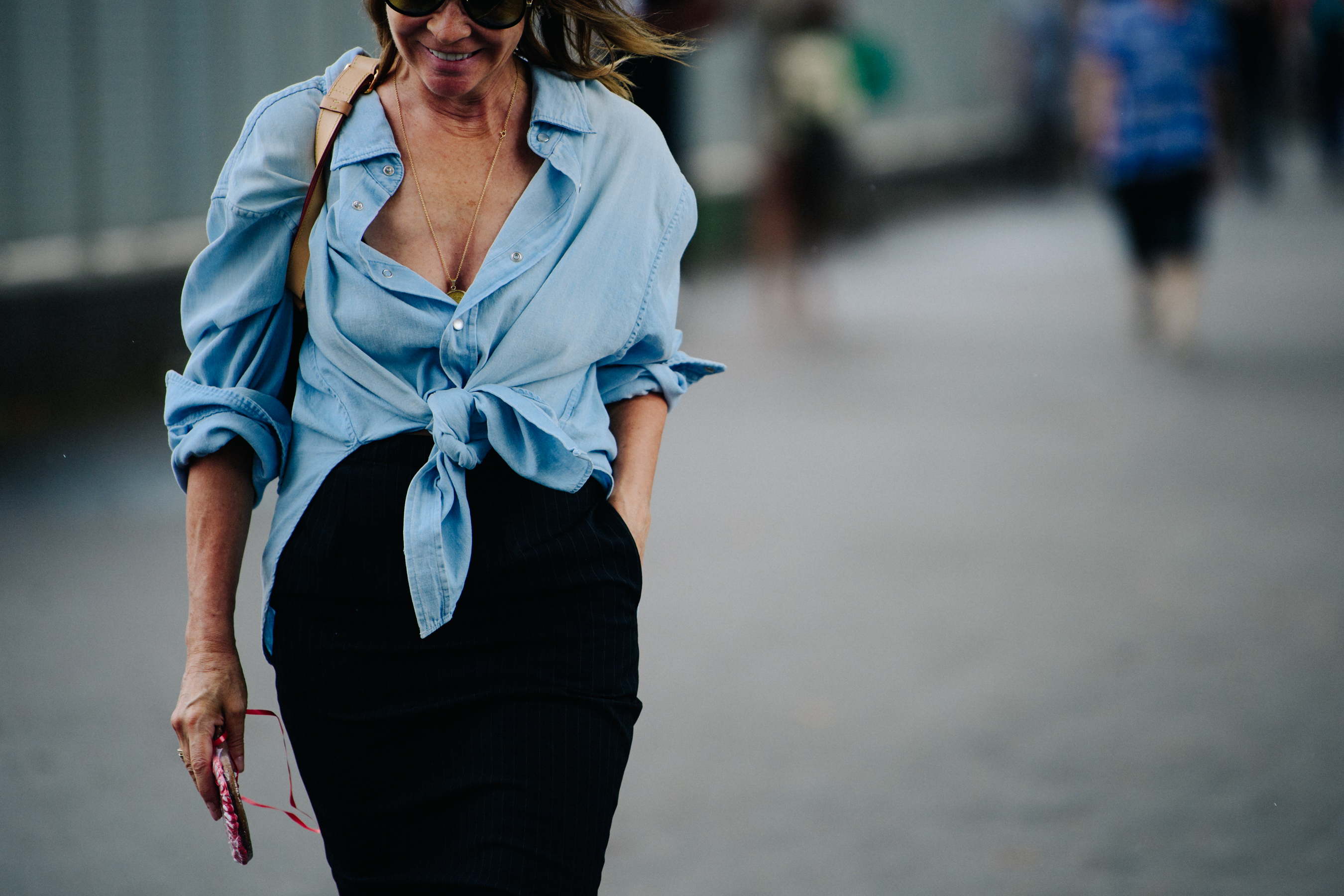 Editor wearing denim shirt