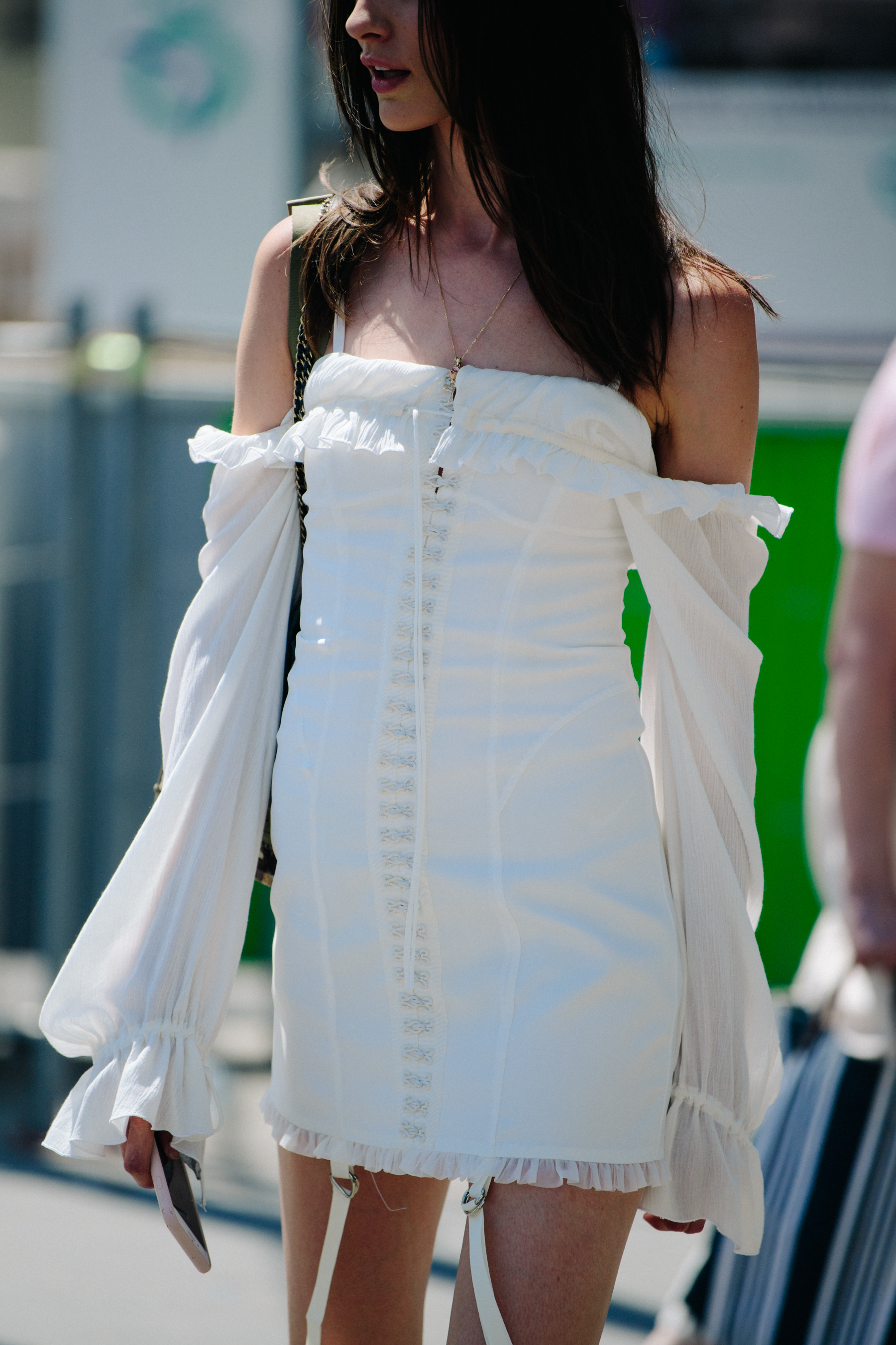 Woman wearing short Chanel dress