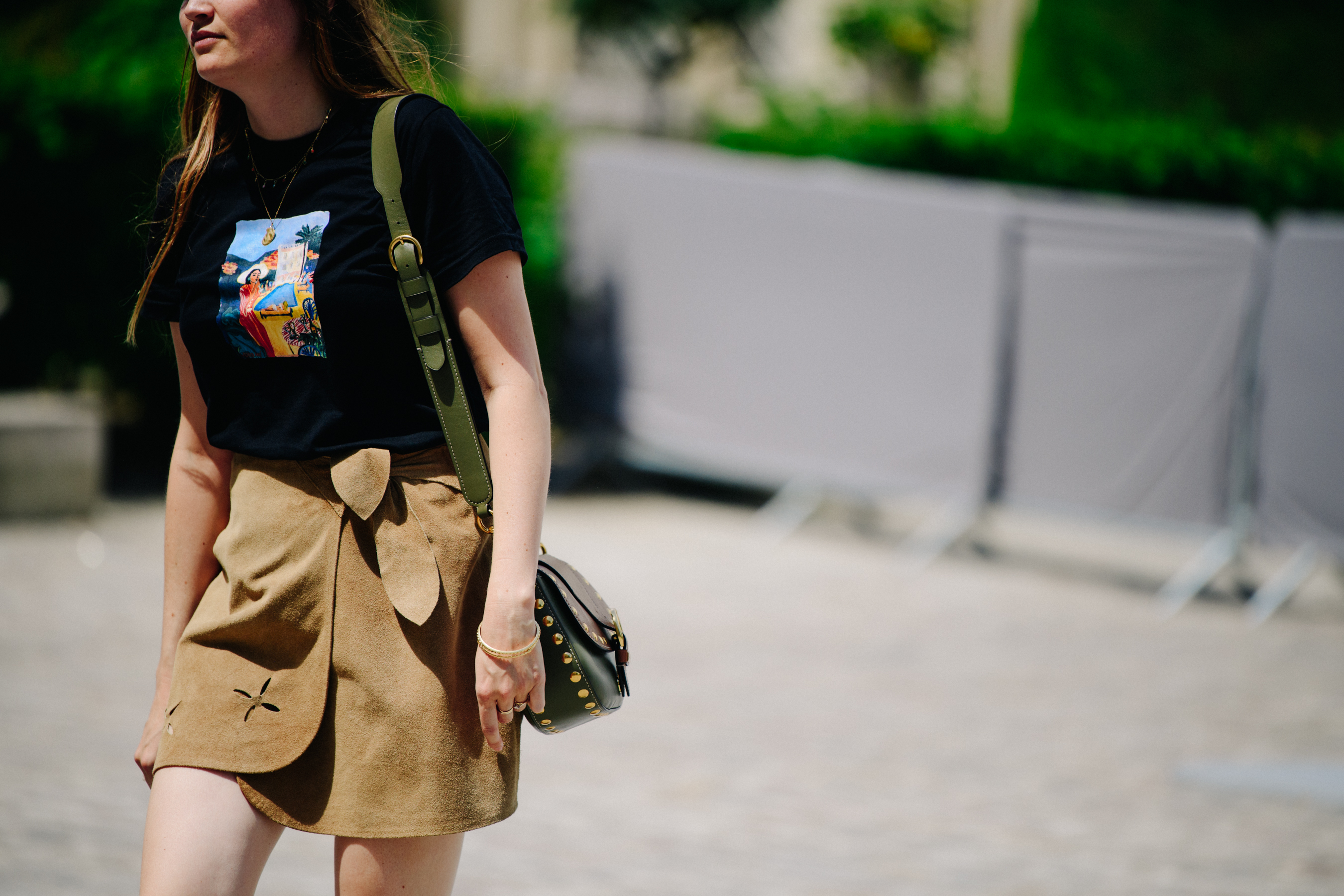Woman wearing tan suede skirt