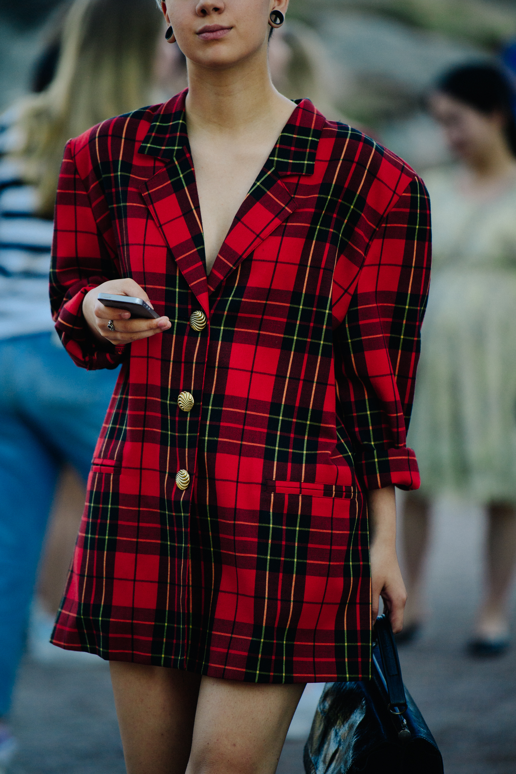 Woman wearing red check jacket