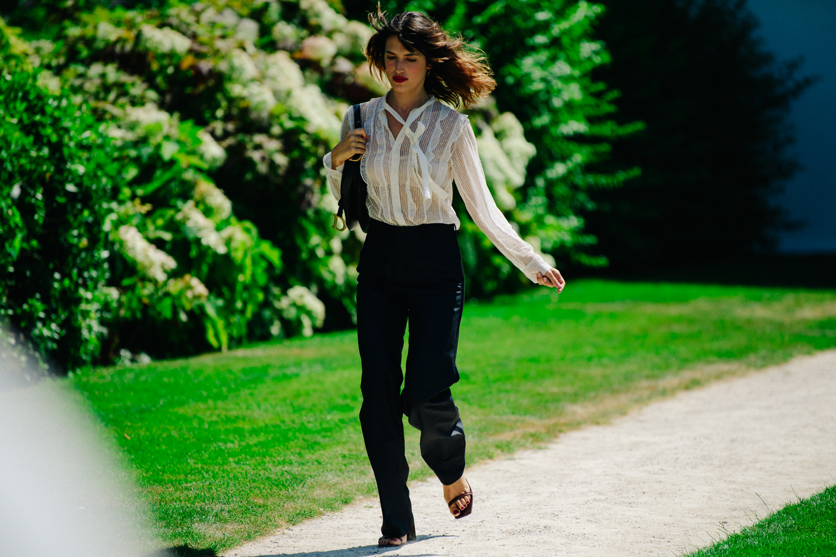 Woman wearing white striped shirt