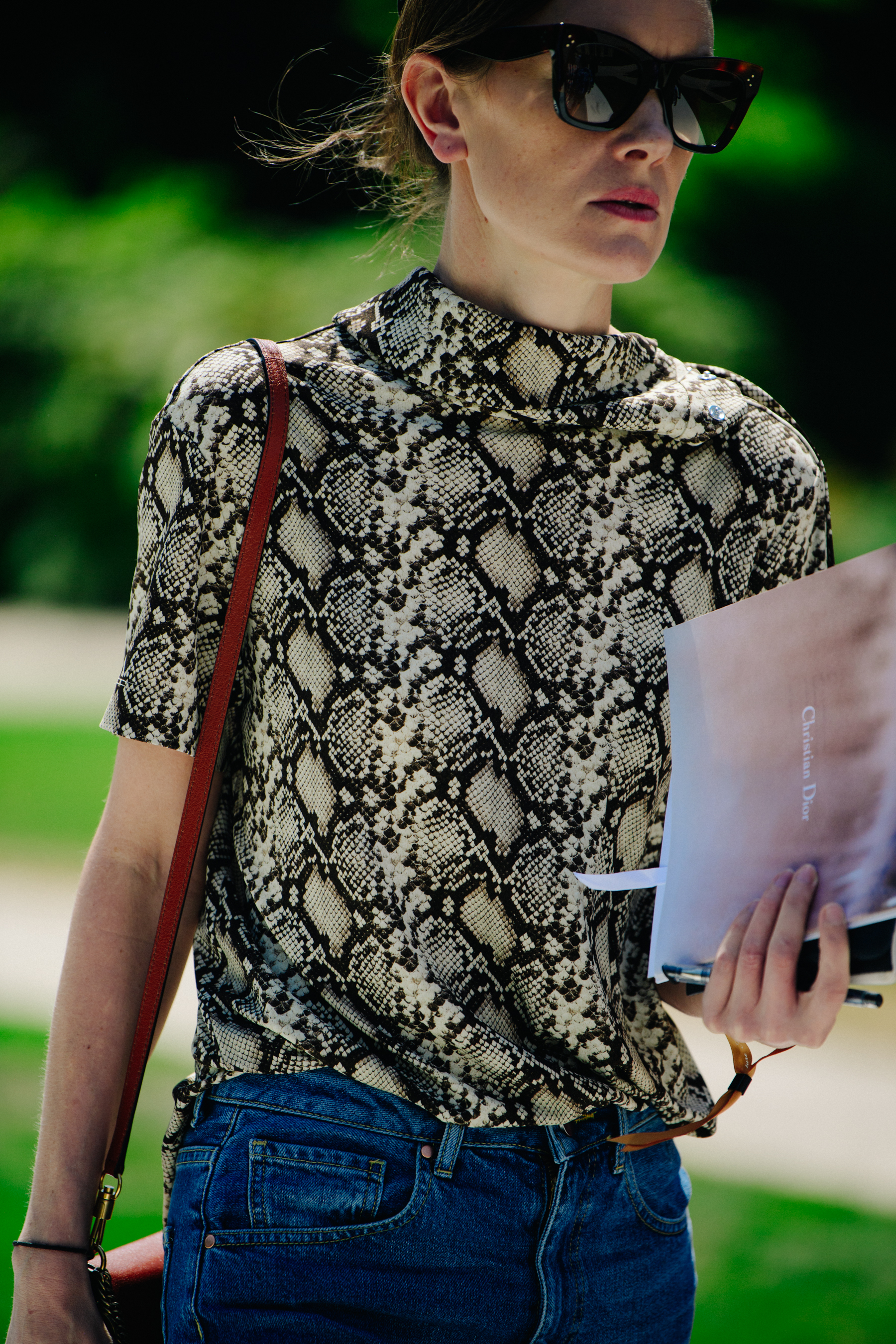 Editor wearing snakeskin top
