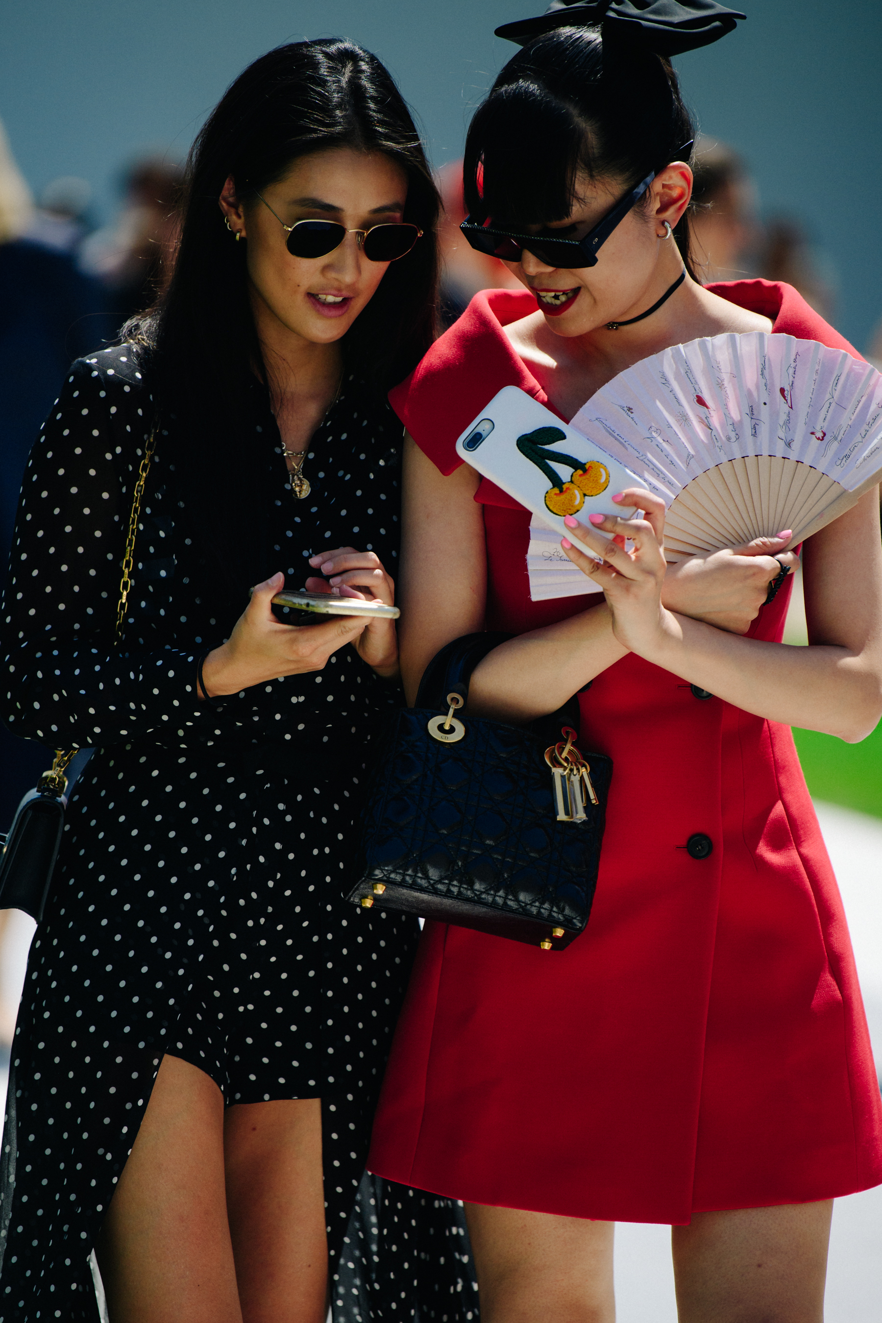 Two Asian bloggers wearing dresses