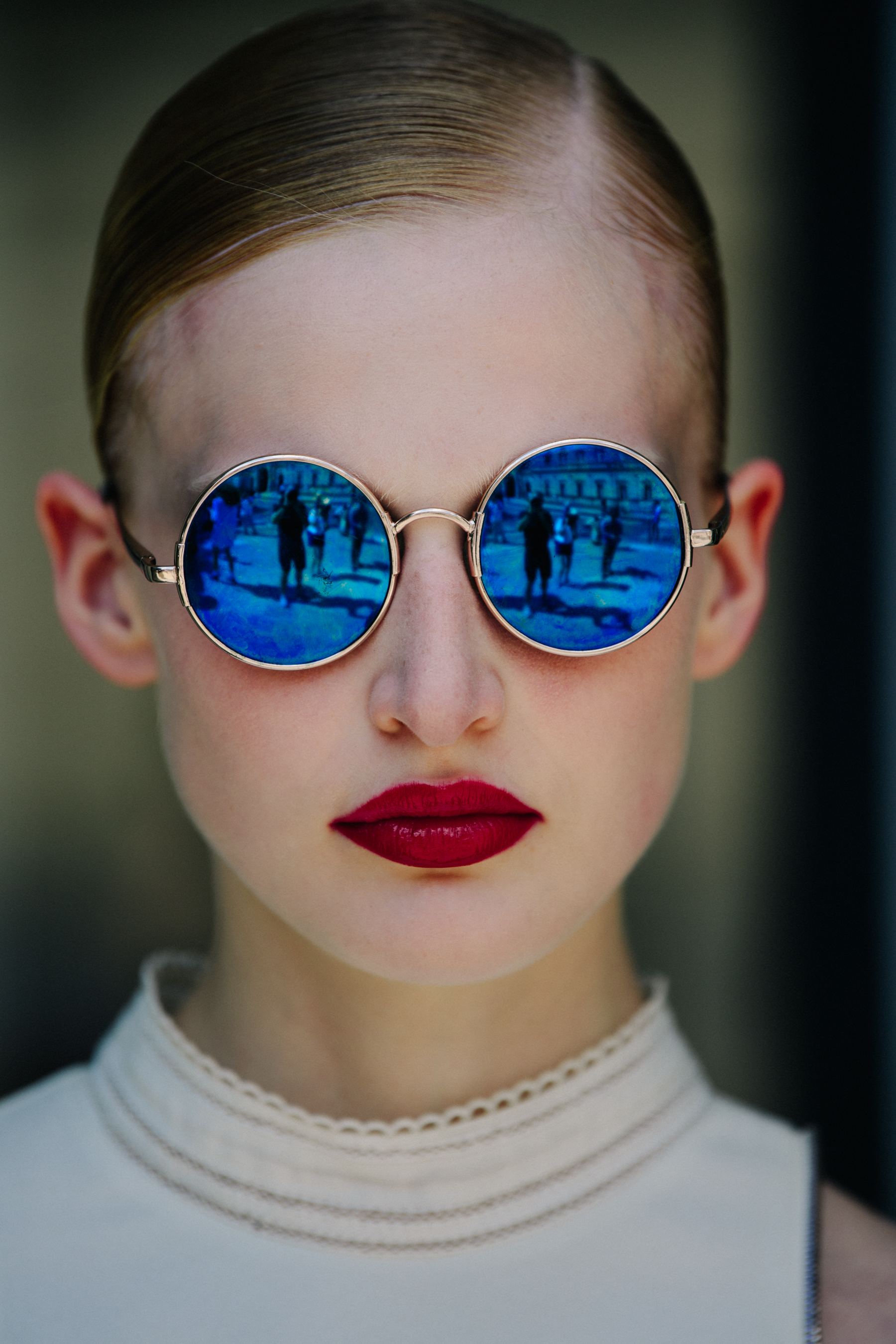 Portrait of model wearing blue sunglasses
