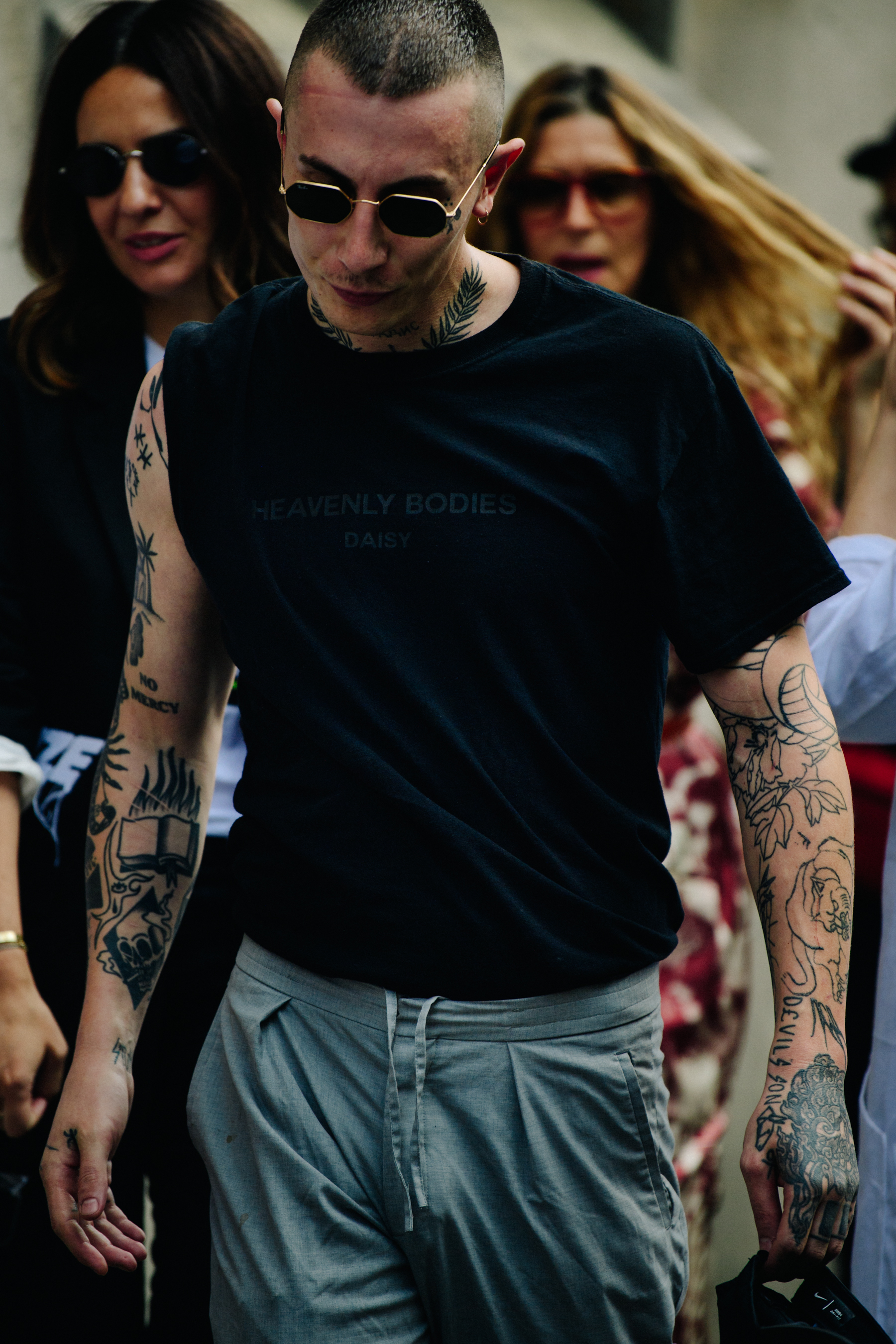 Tattoo artist wearing a black tee shirt