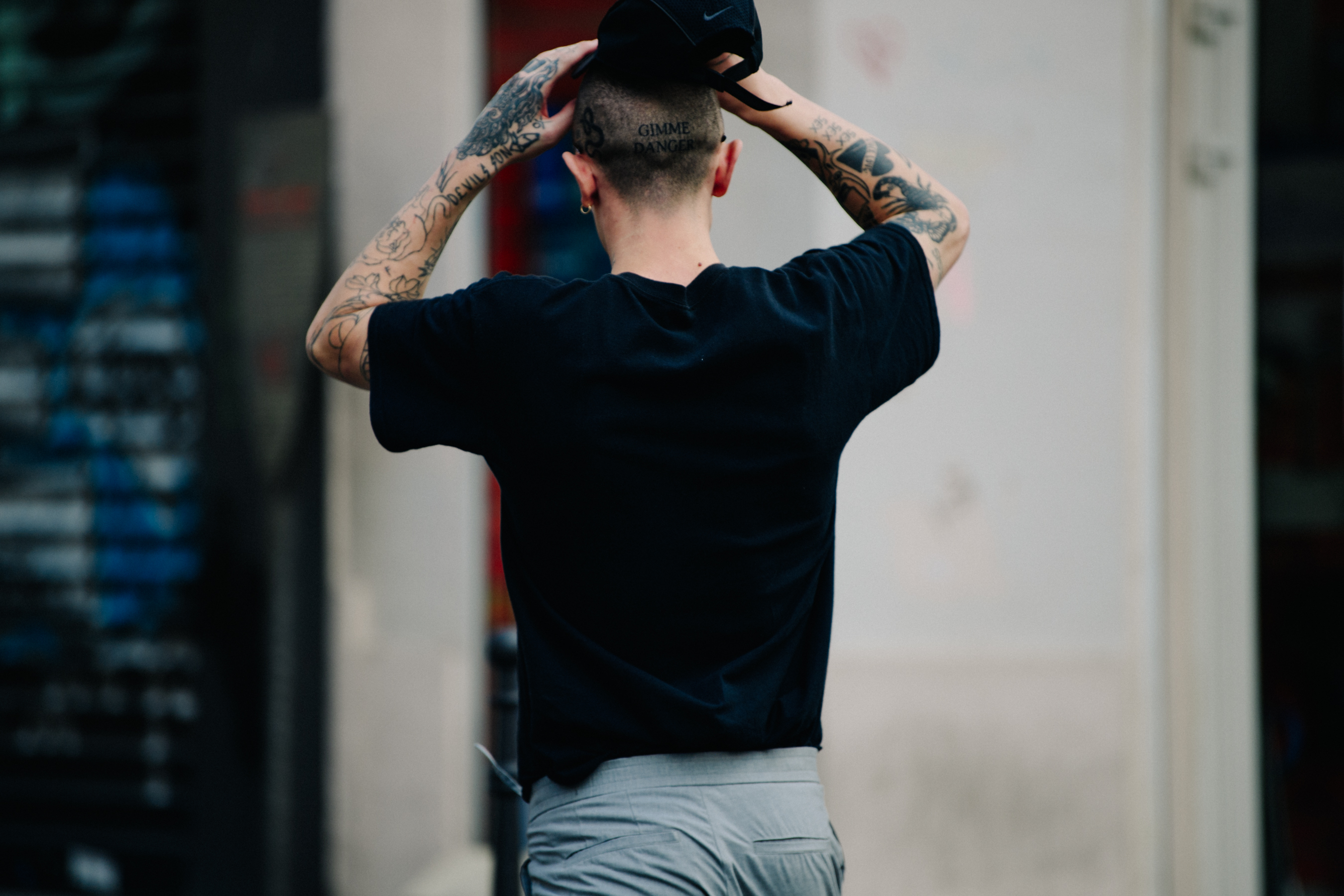 Tattoo artist wearing a black tee shirt