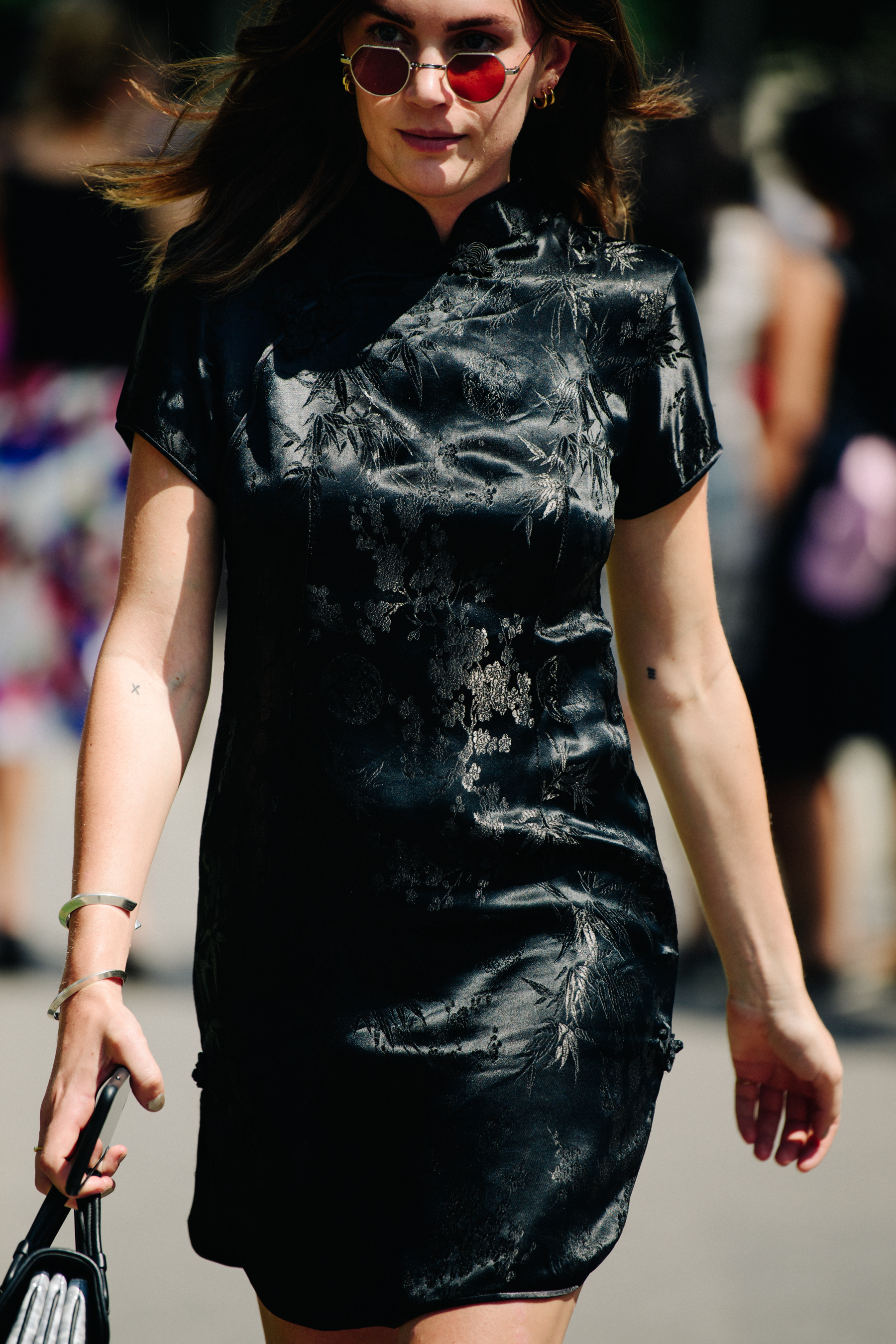 Woman wearing black asian-style dress