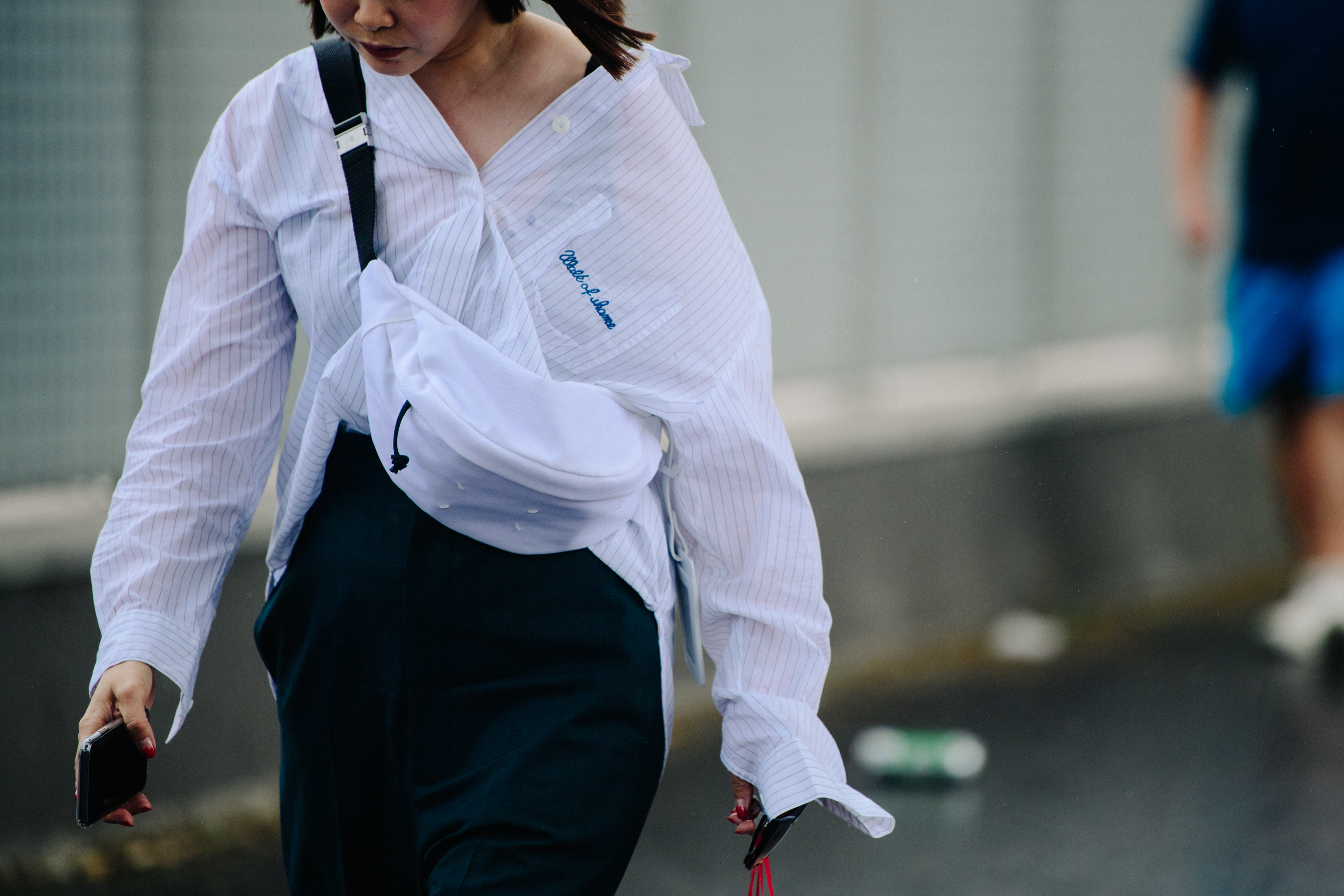 Woman wearing white striped shirt