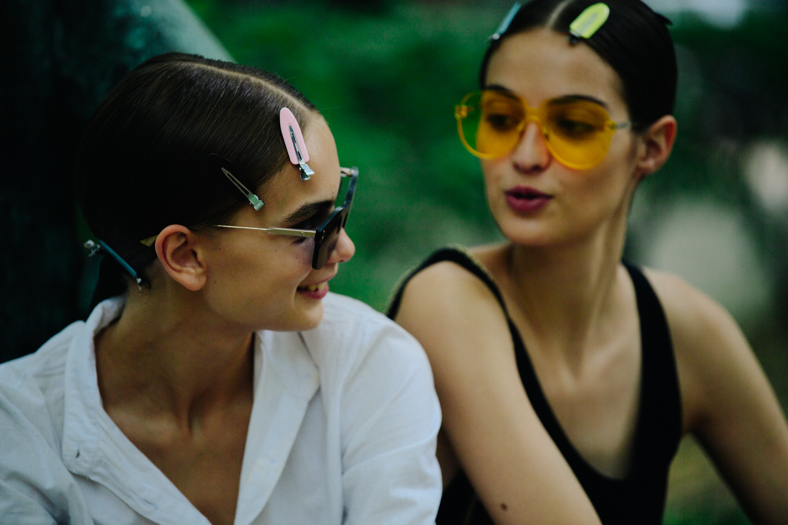 Two models wearing Christian Dior glasses