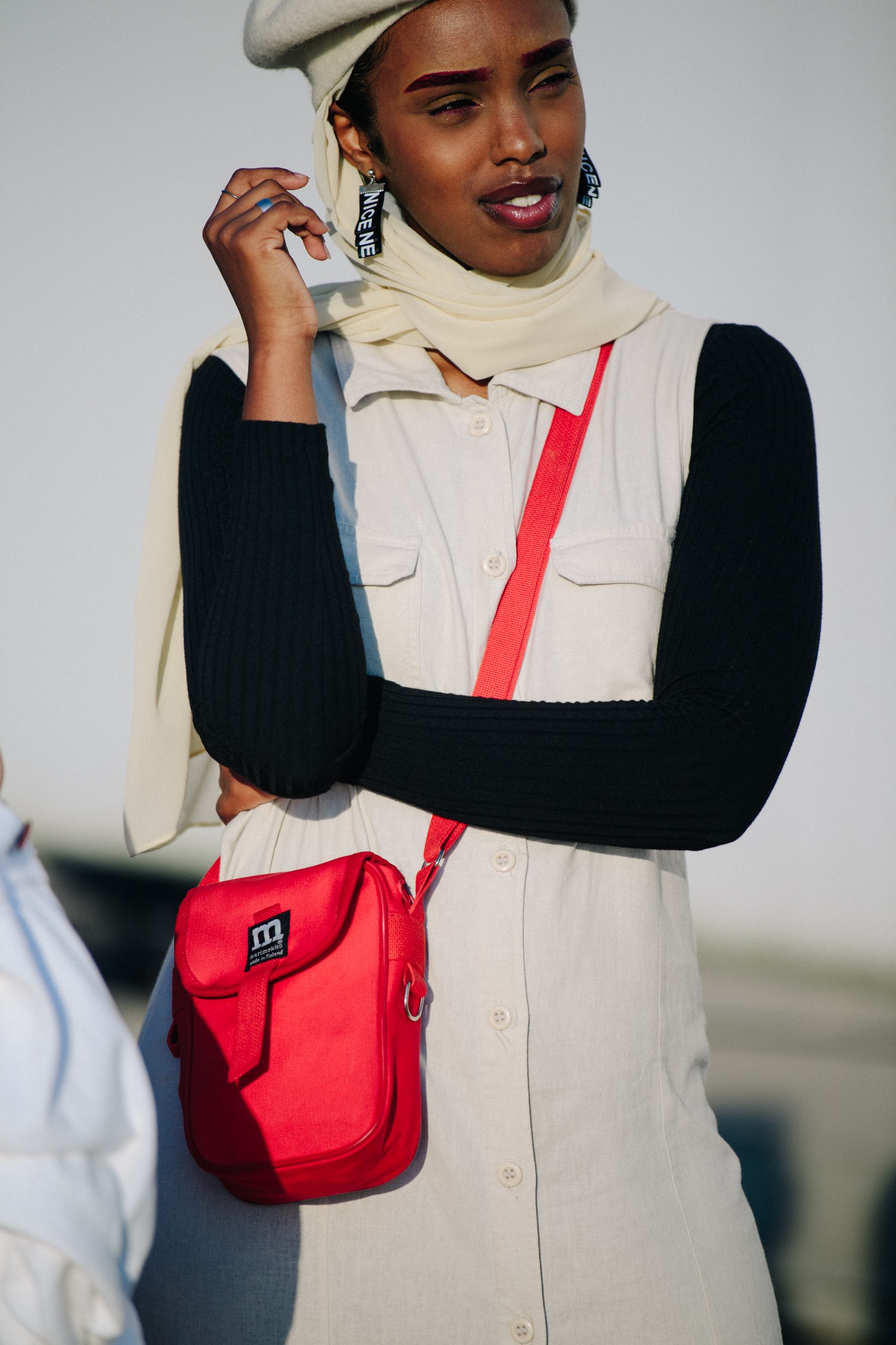 Woman carrying red bag