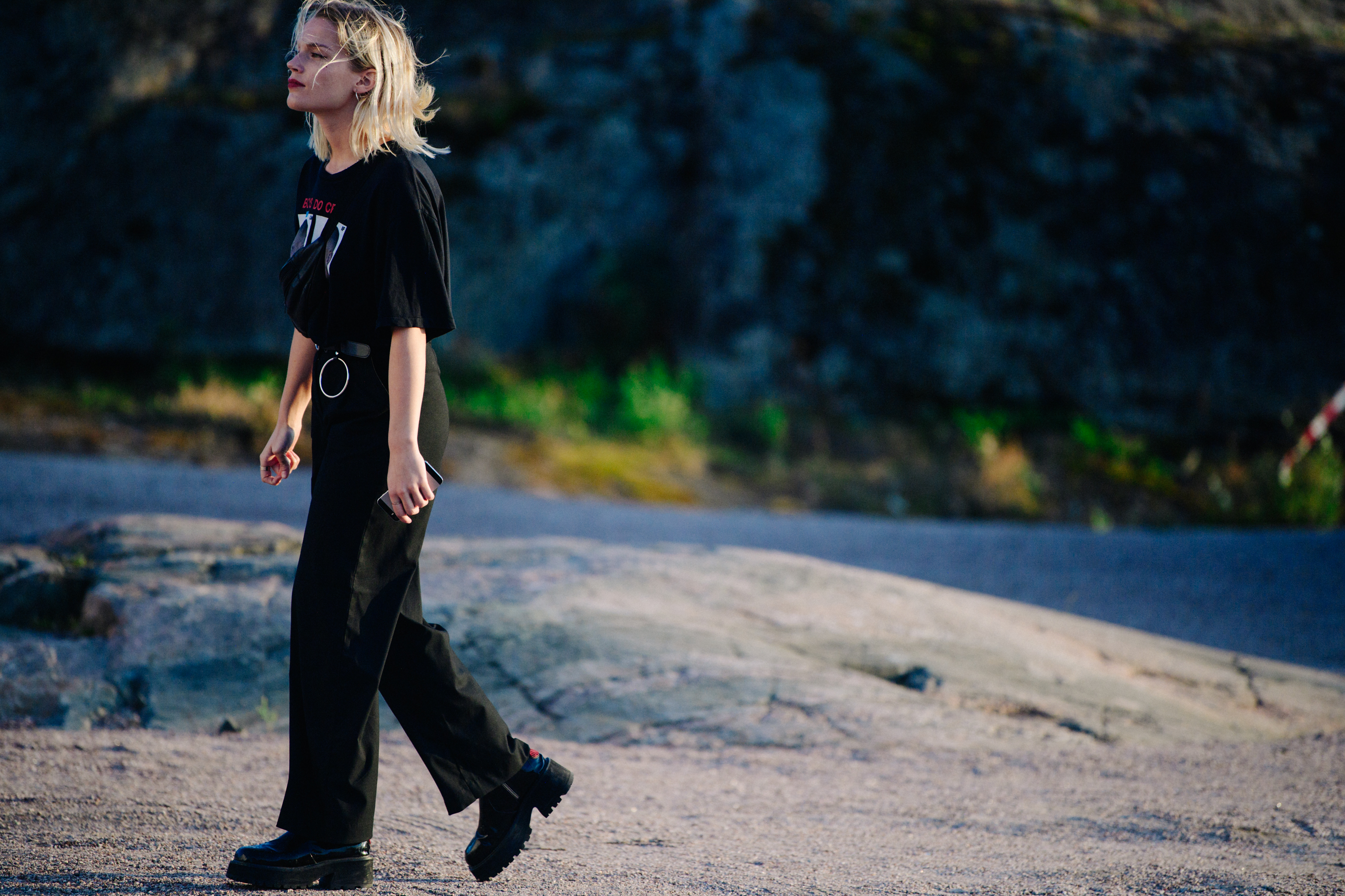 Woman wearing black tee and pants