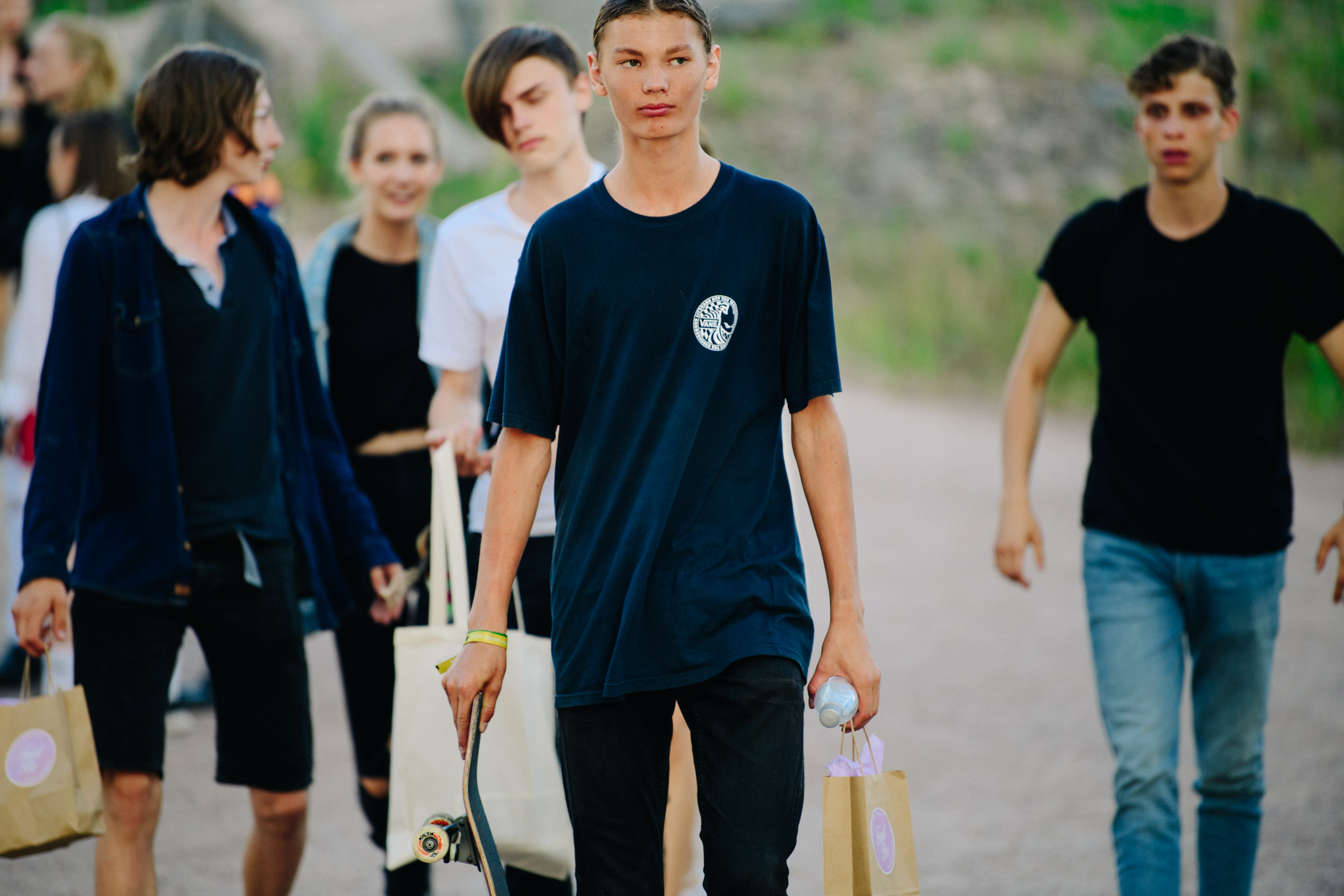 Man wearing black Vans tee shirt