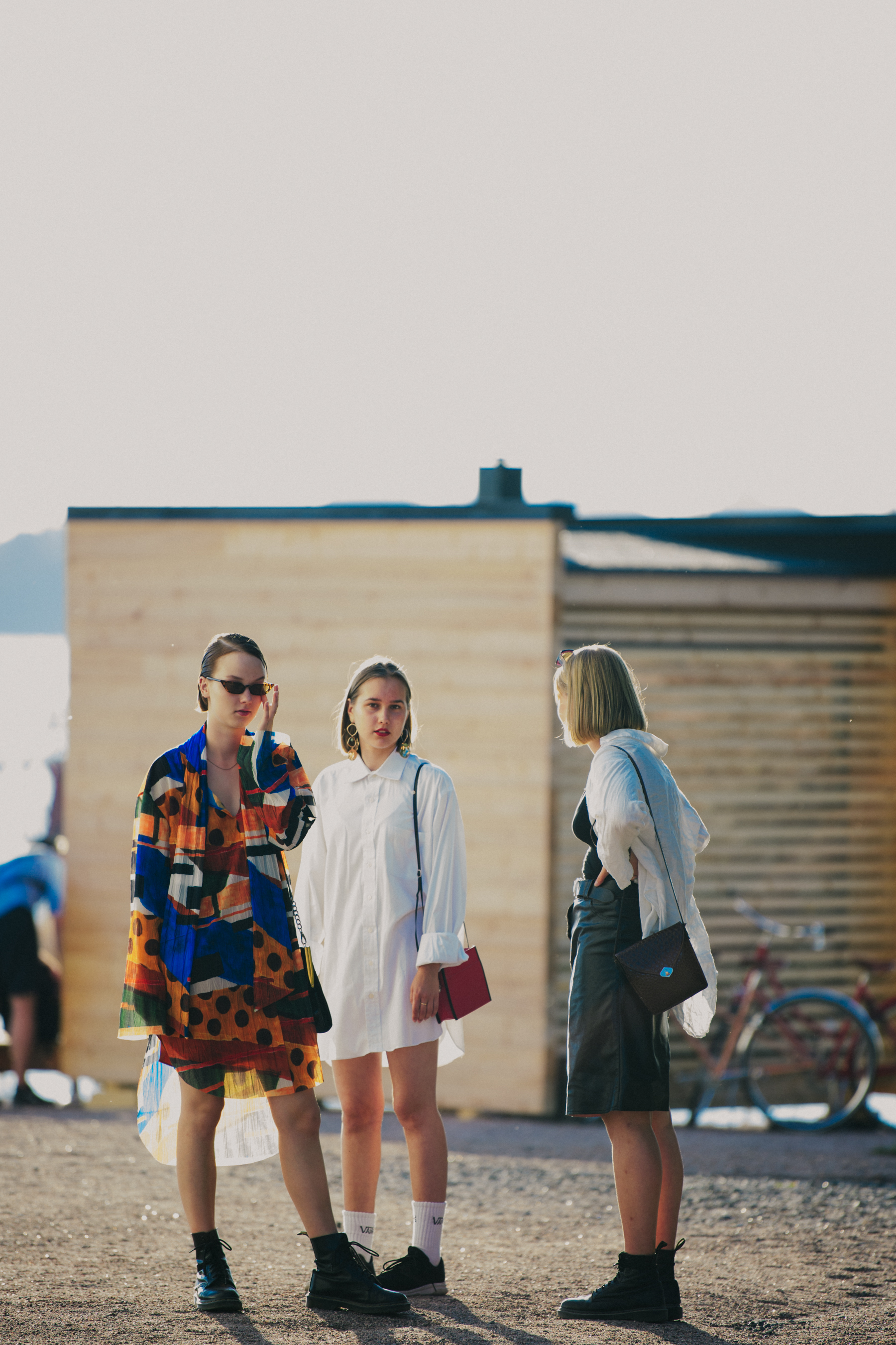 Three women wearing stylish clothing