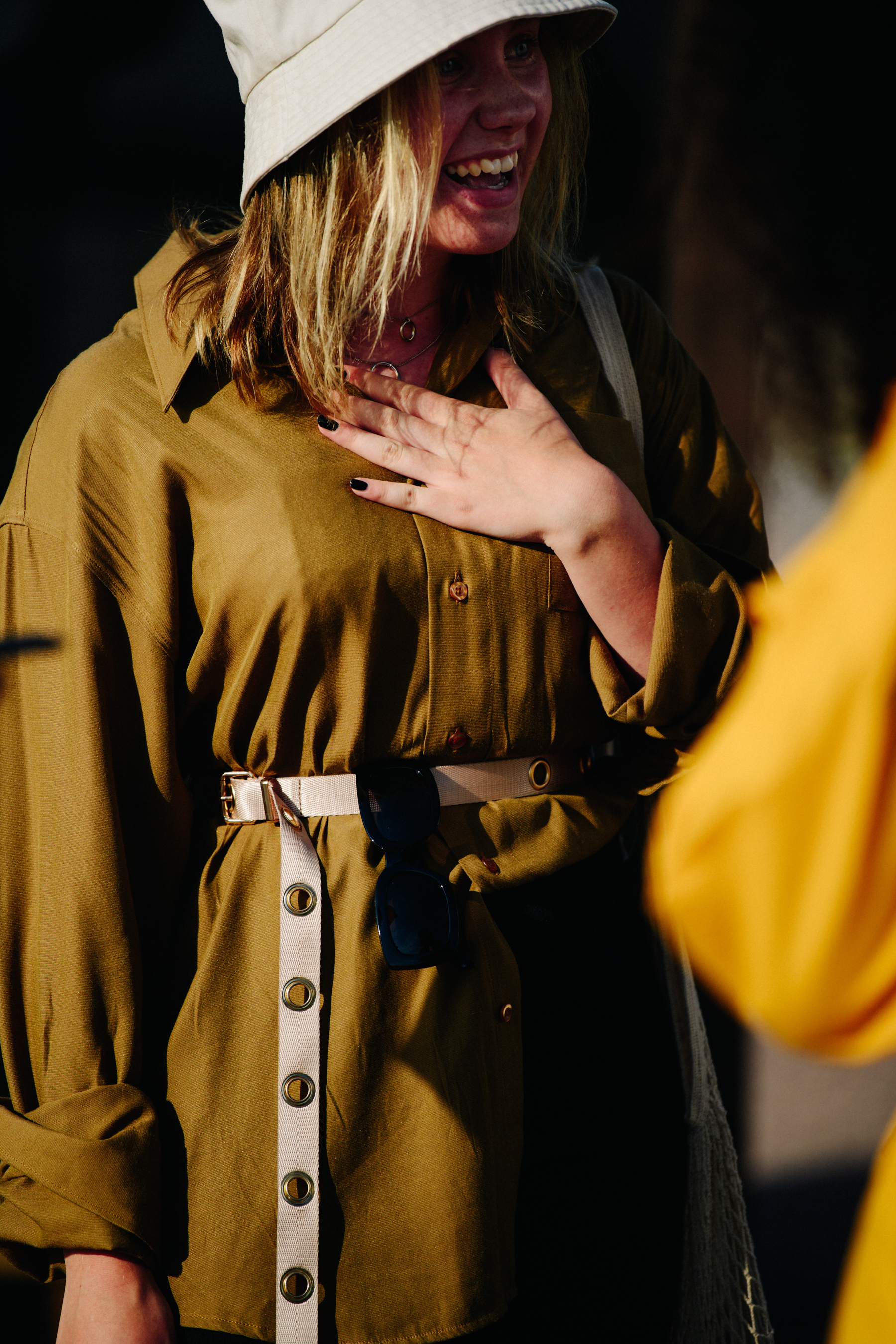 Woman wearing gold shirt
