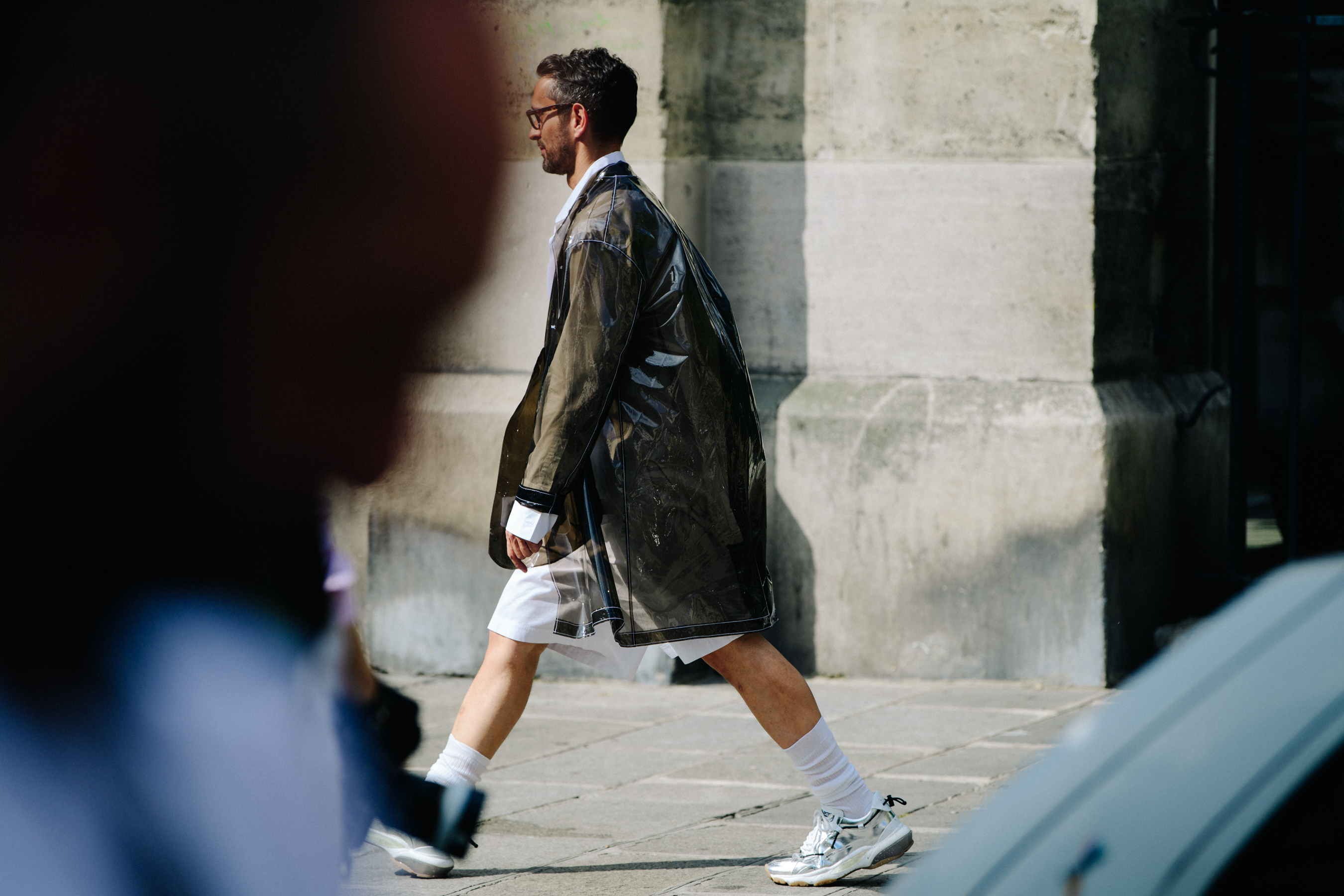 Man wearing plastic coat