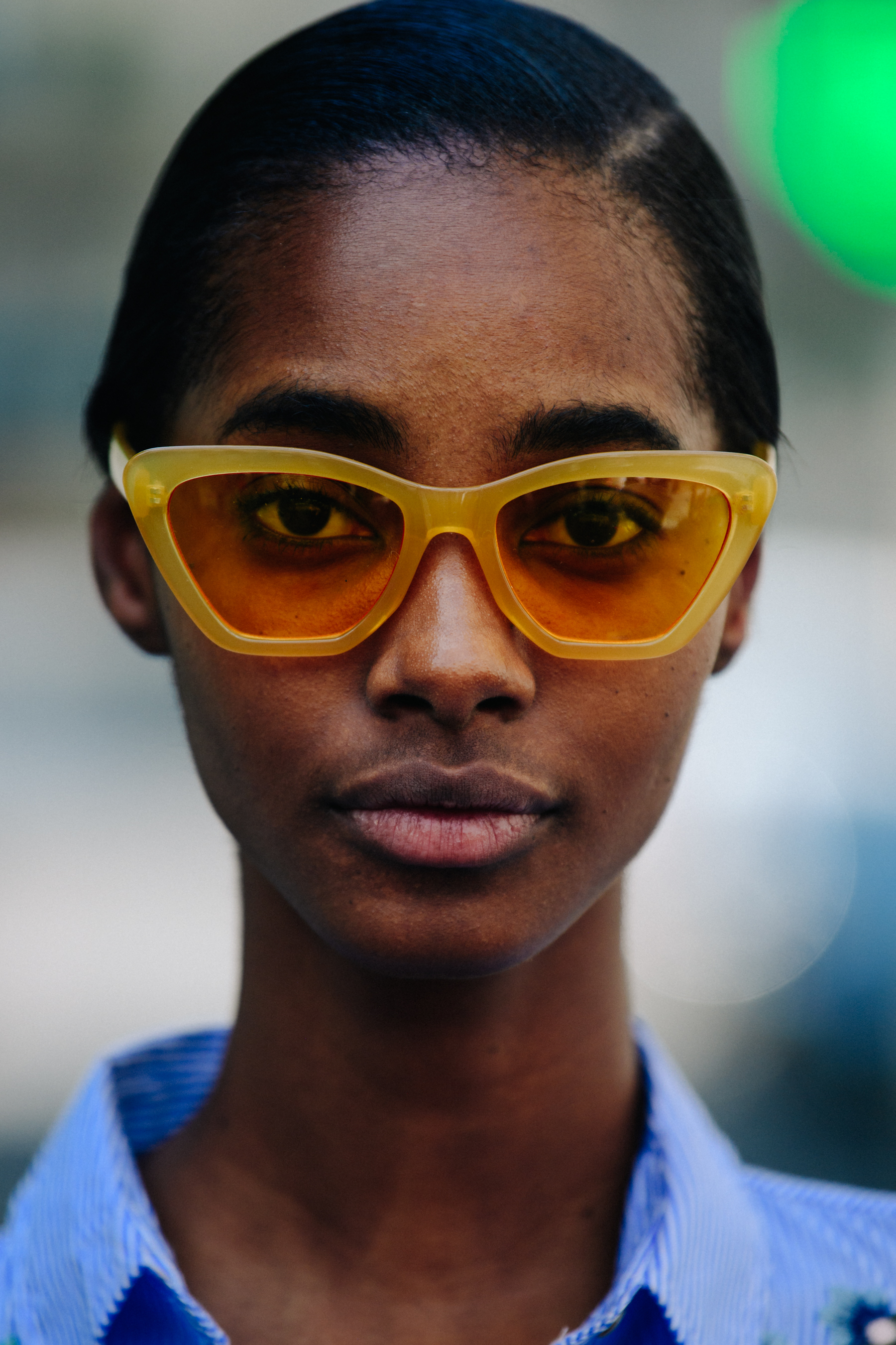 Portrait of model wearing yellow sunglasses