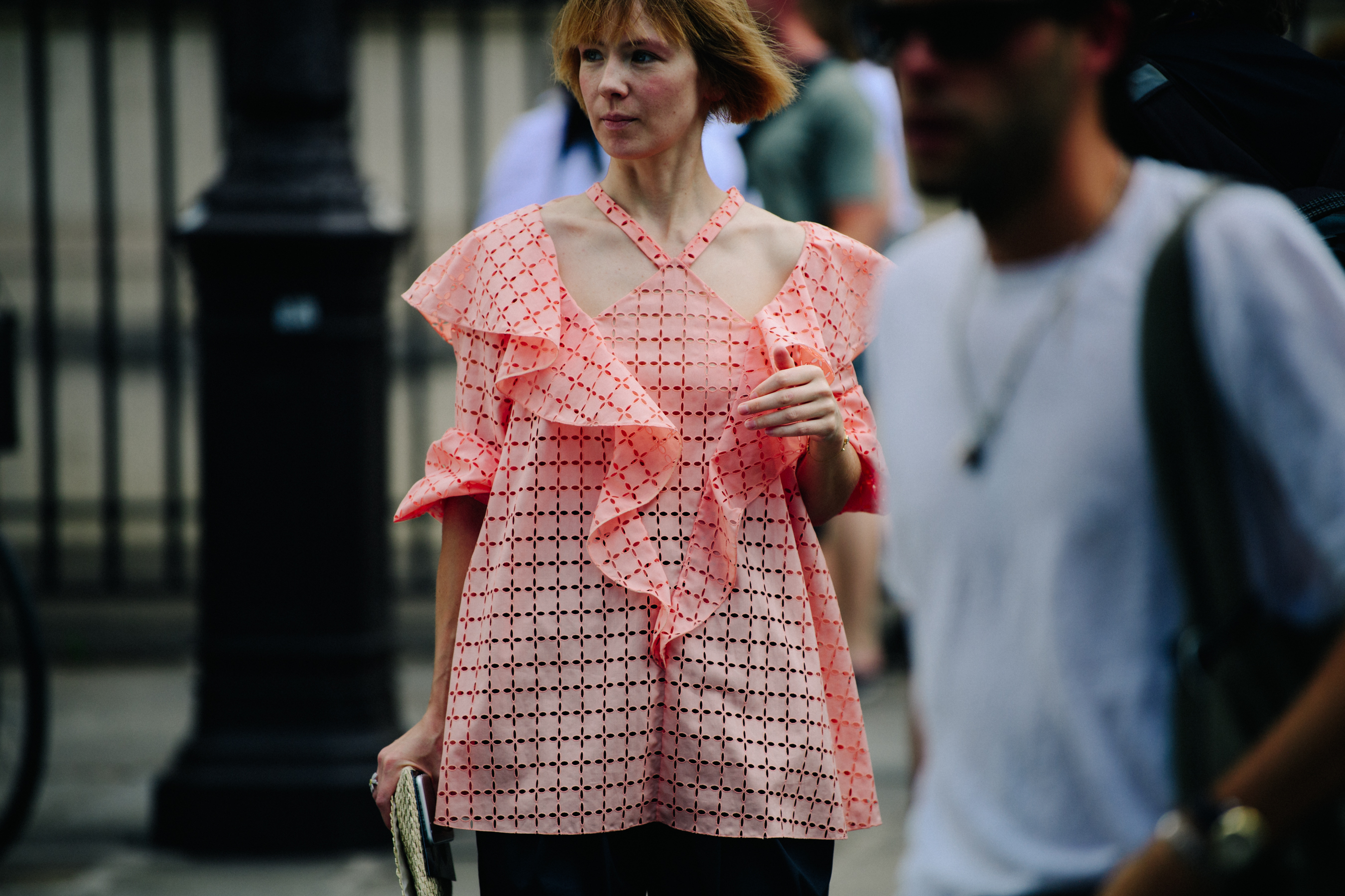 Woman wearing pink cut-out top