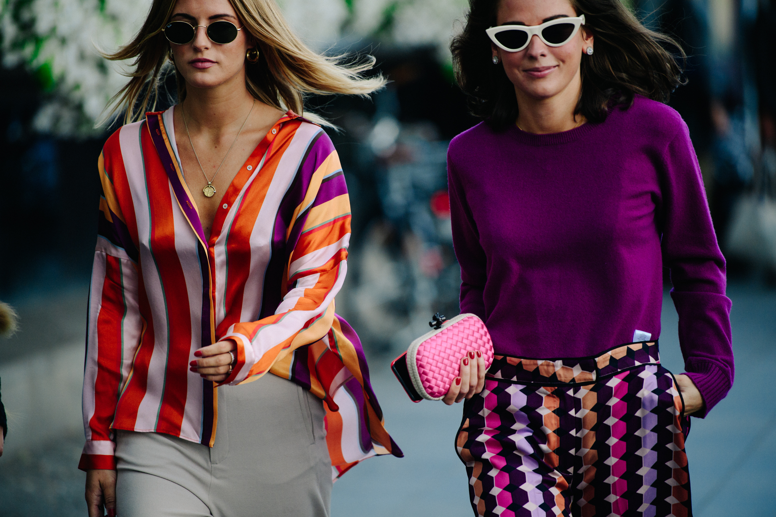 Two women wearing colourful patterns