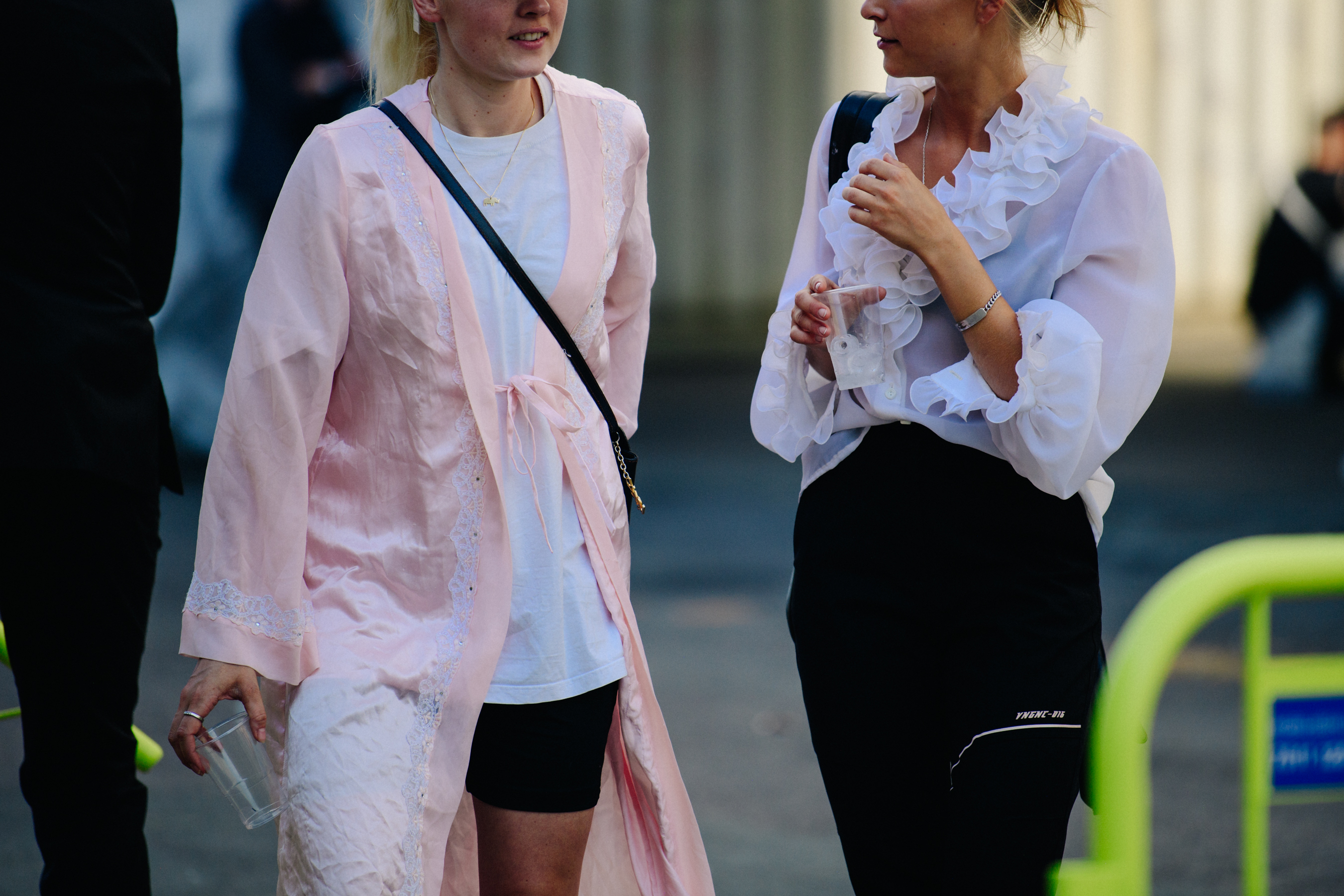 Two women wearing light shirts