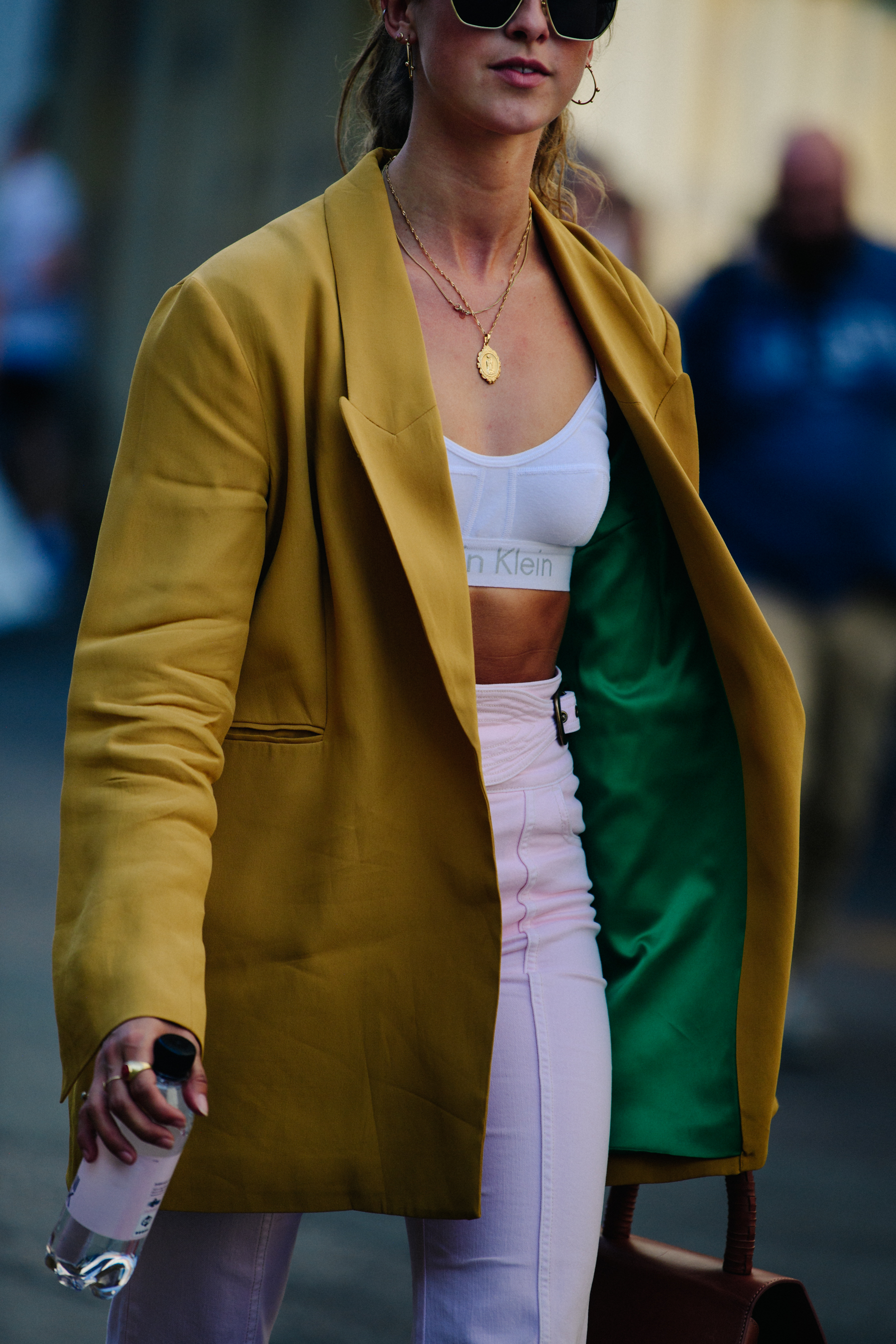 Woman wearing gold jacket