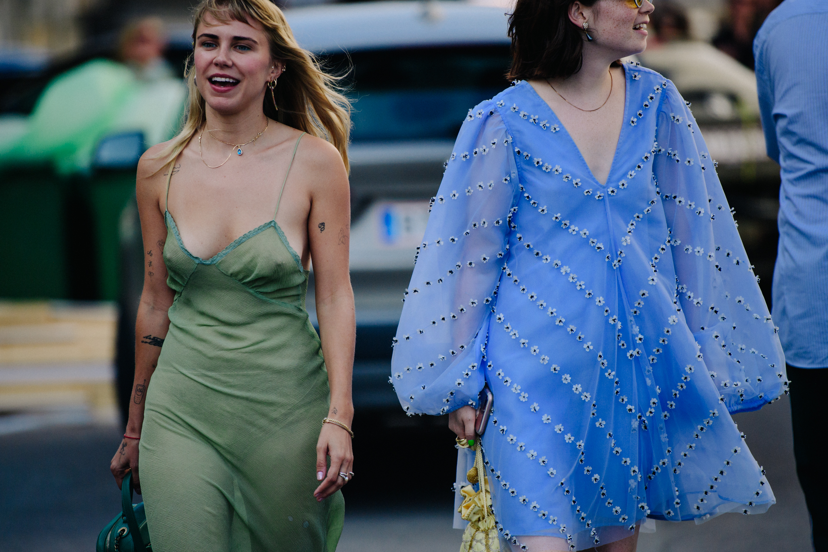 Two women wearing flowing tops