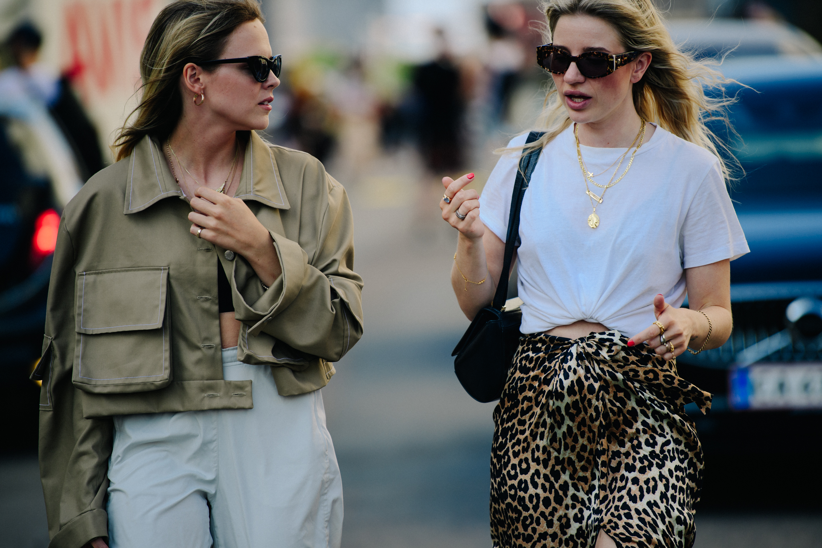 Two women wearing dark sunglasses