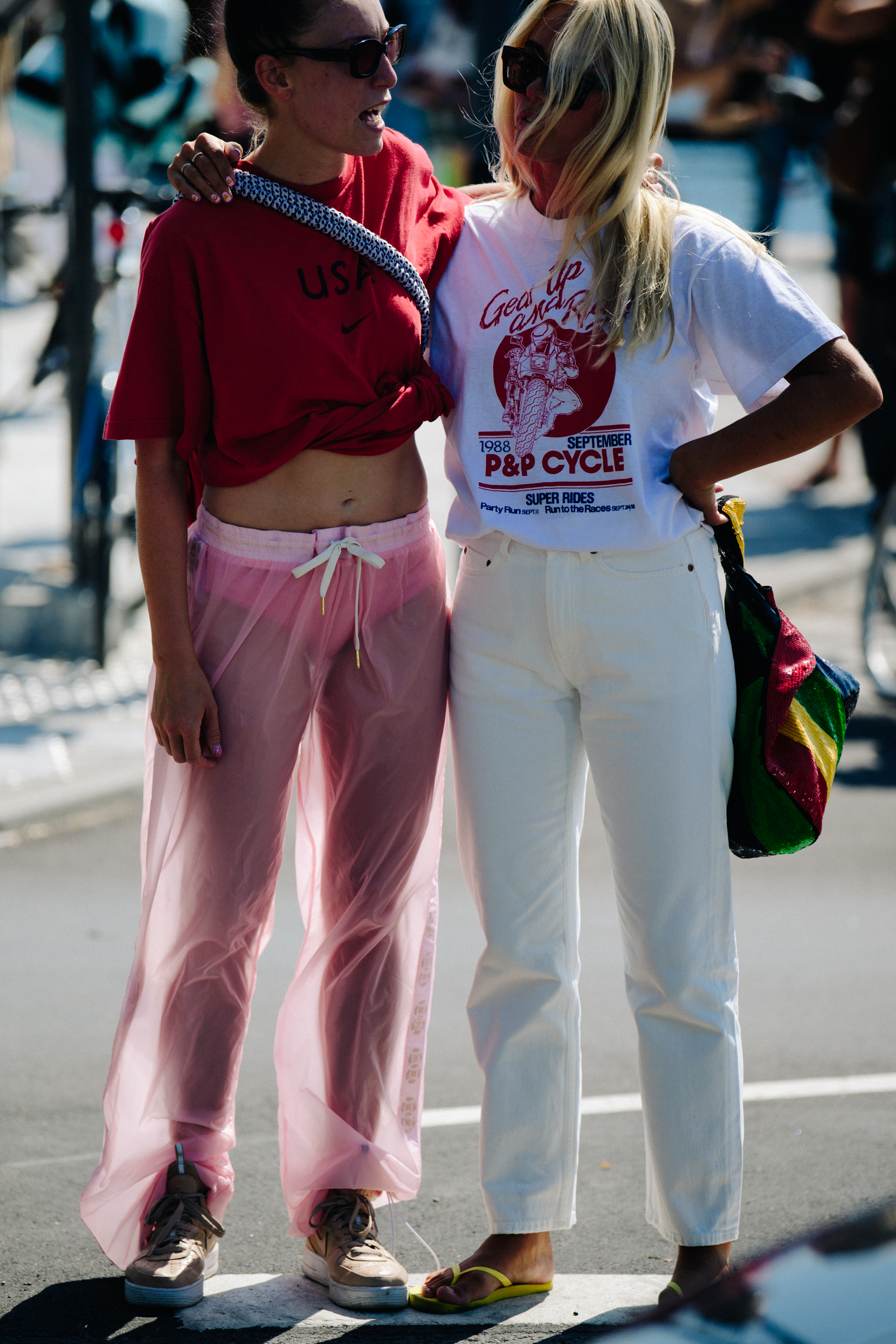 Two women wearing light clothing