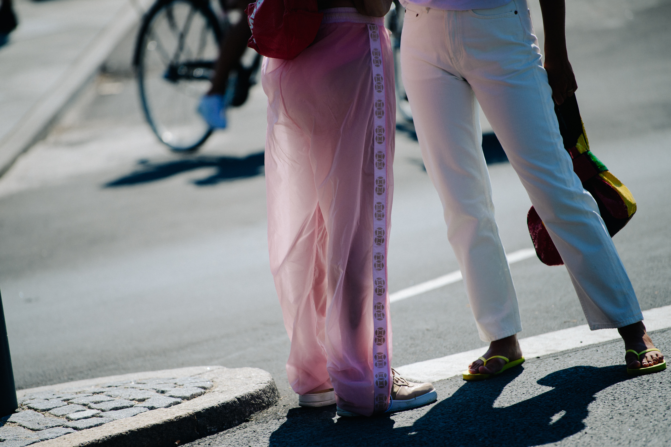 Two women wearing light clothing