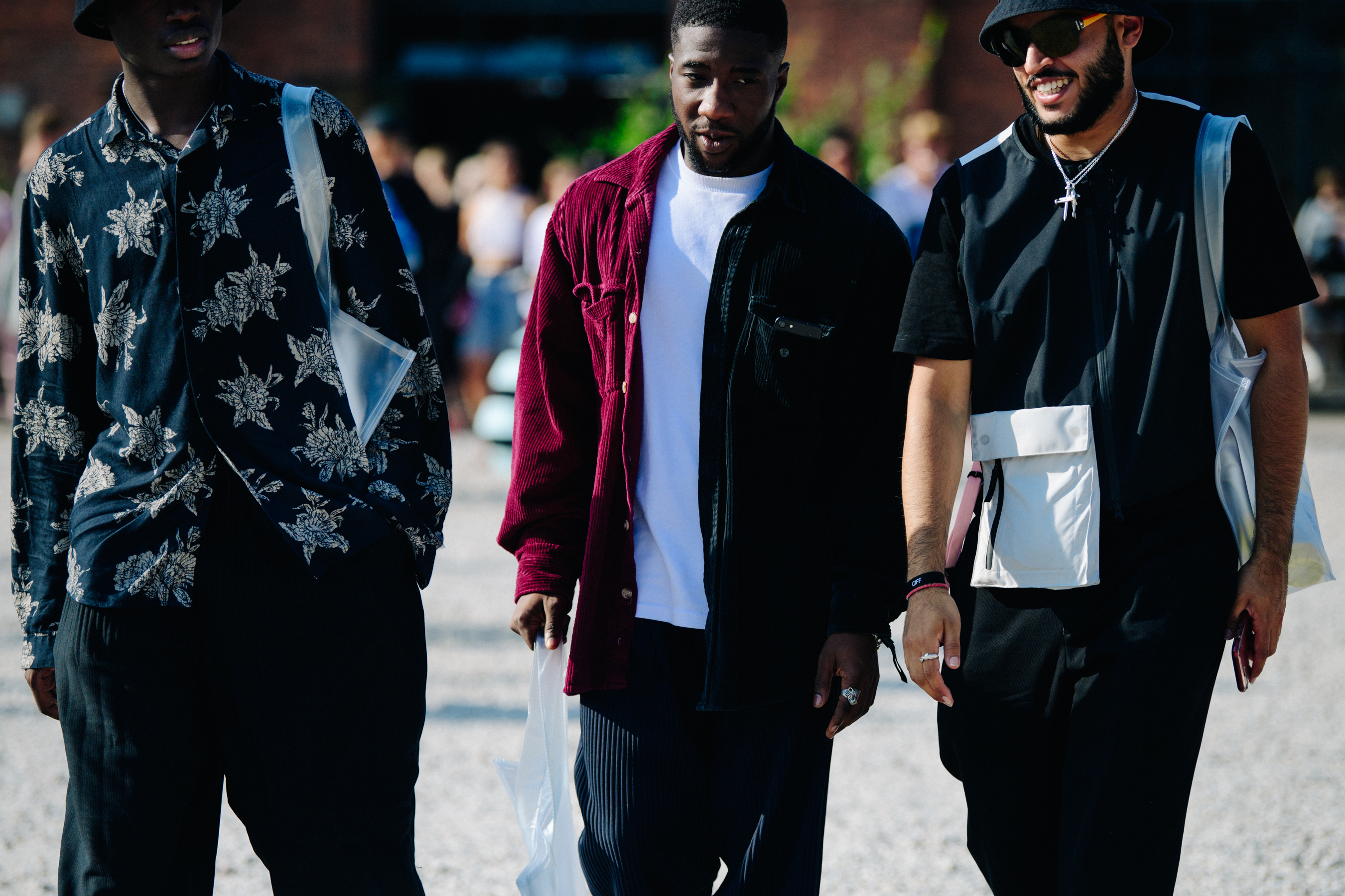 Three men wearing dark colours