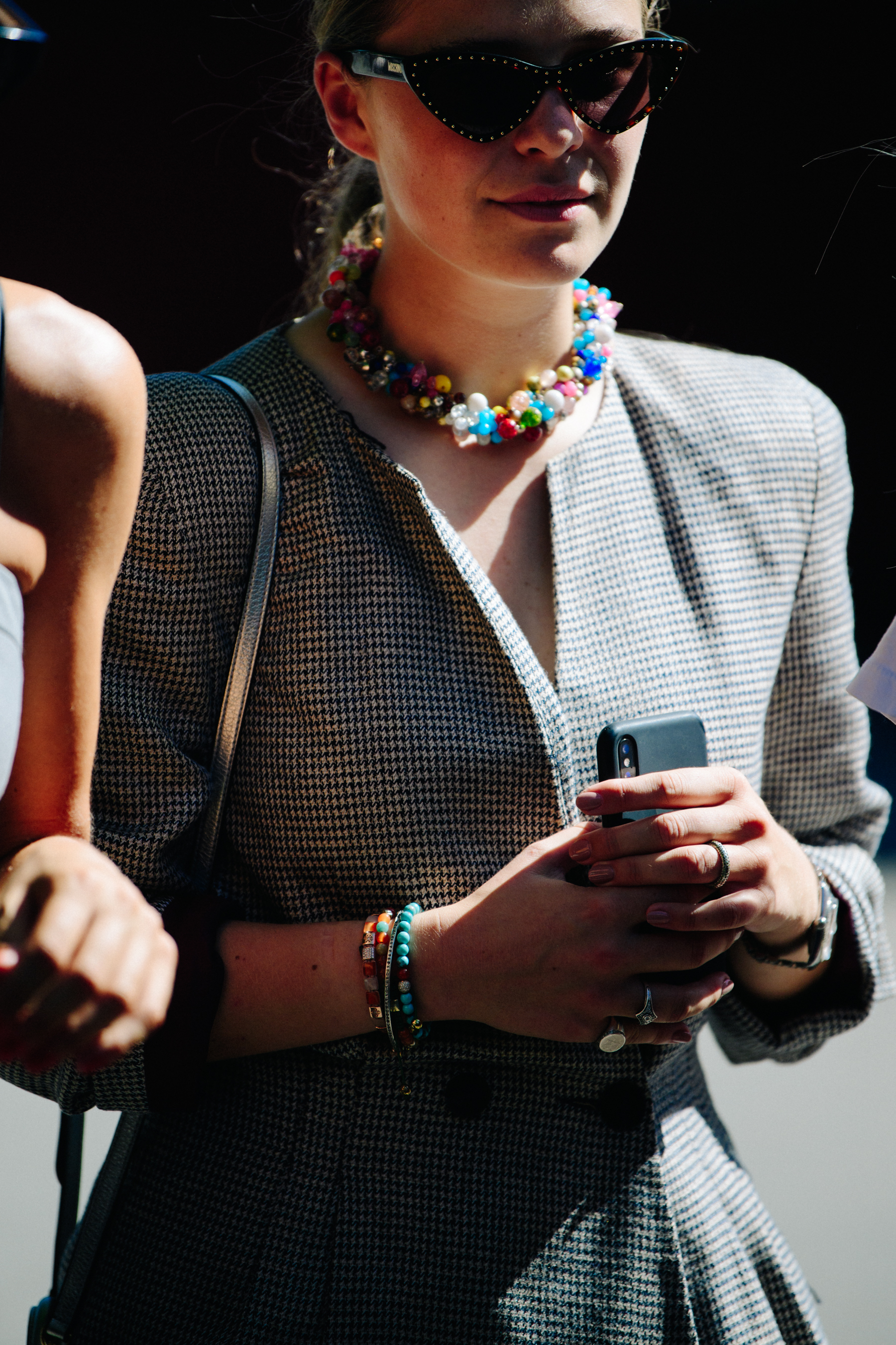 Woman wearing colourful necklace