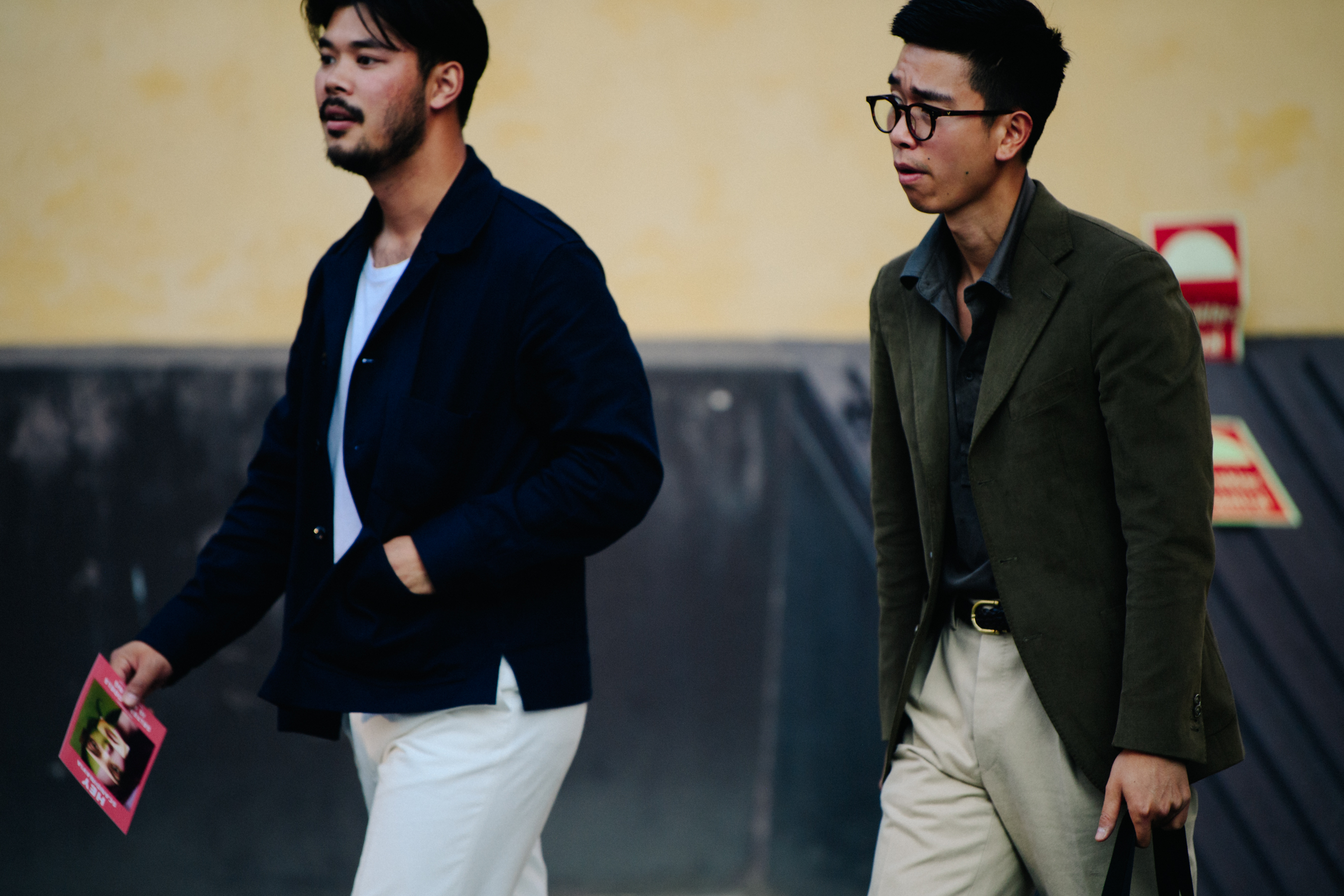 Two men wearing dark blazers