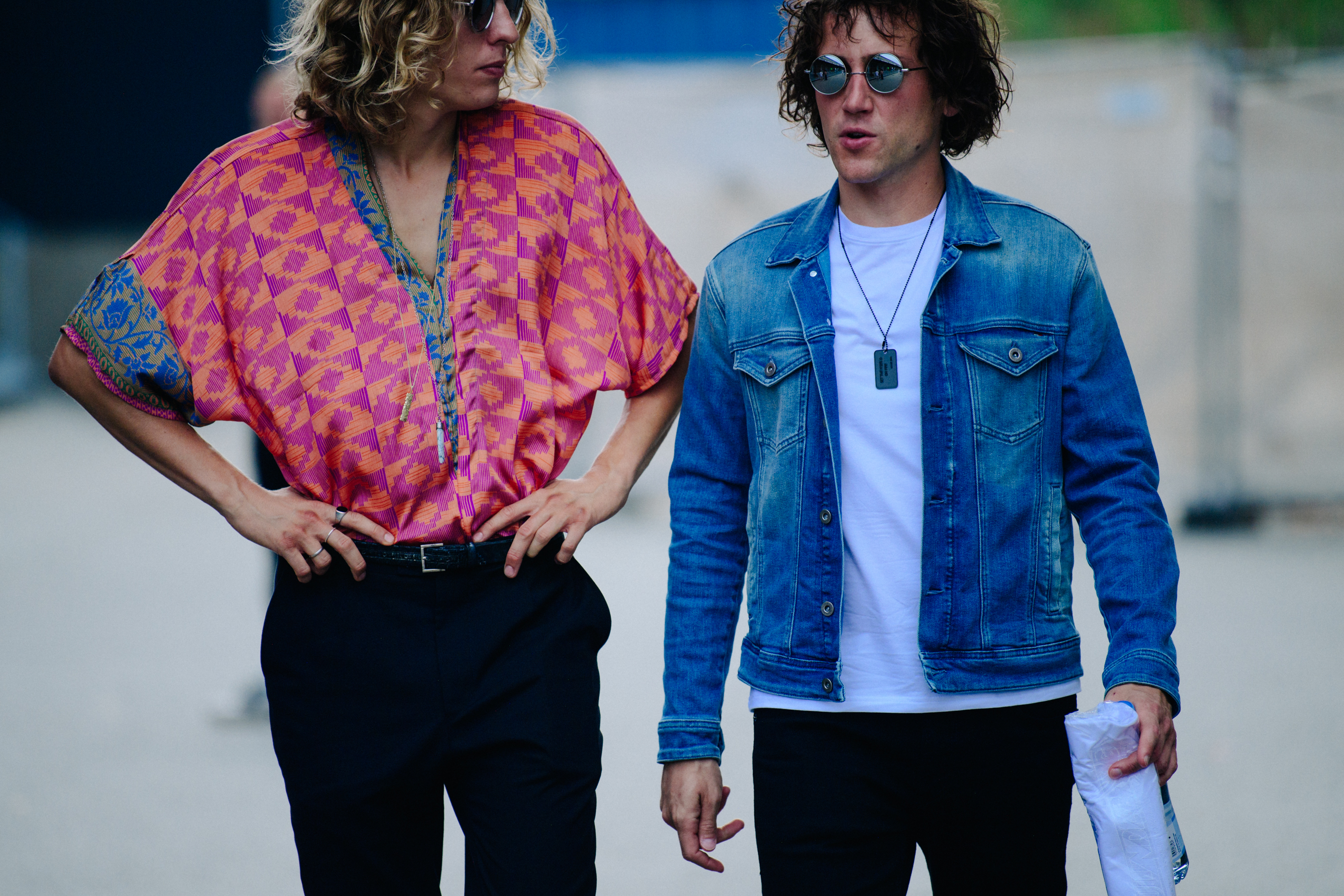 Two men wearing light outfits