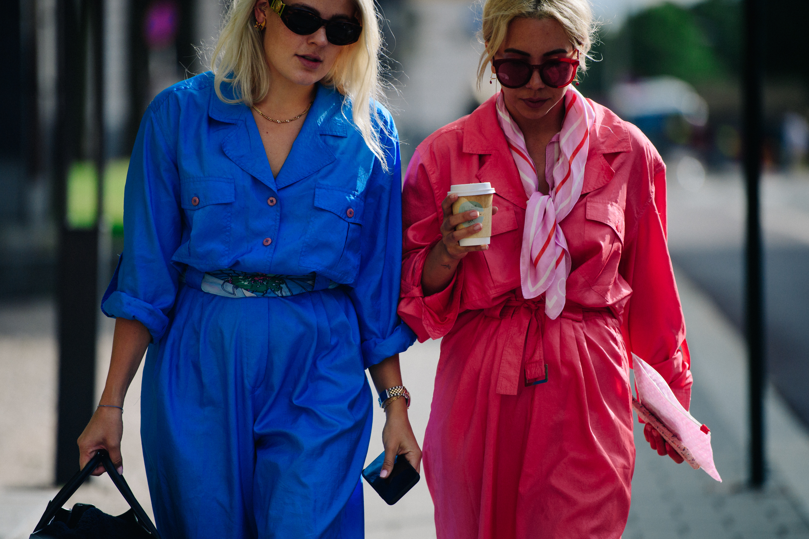 Two women wearing blue and pink