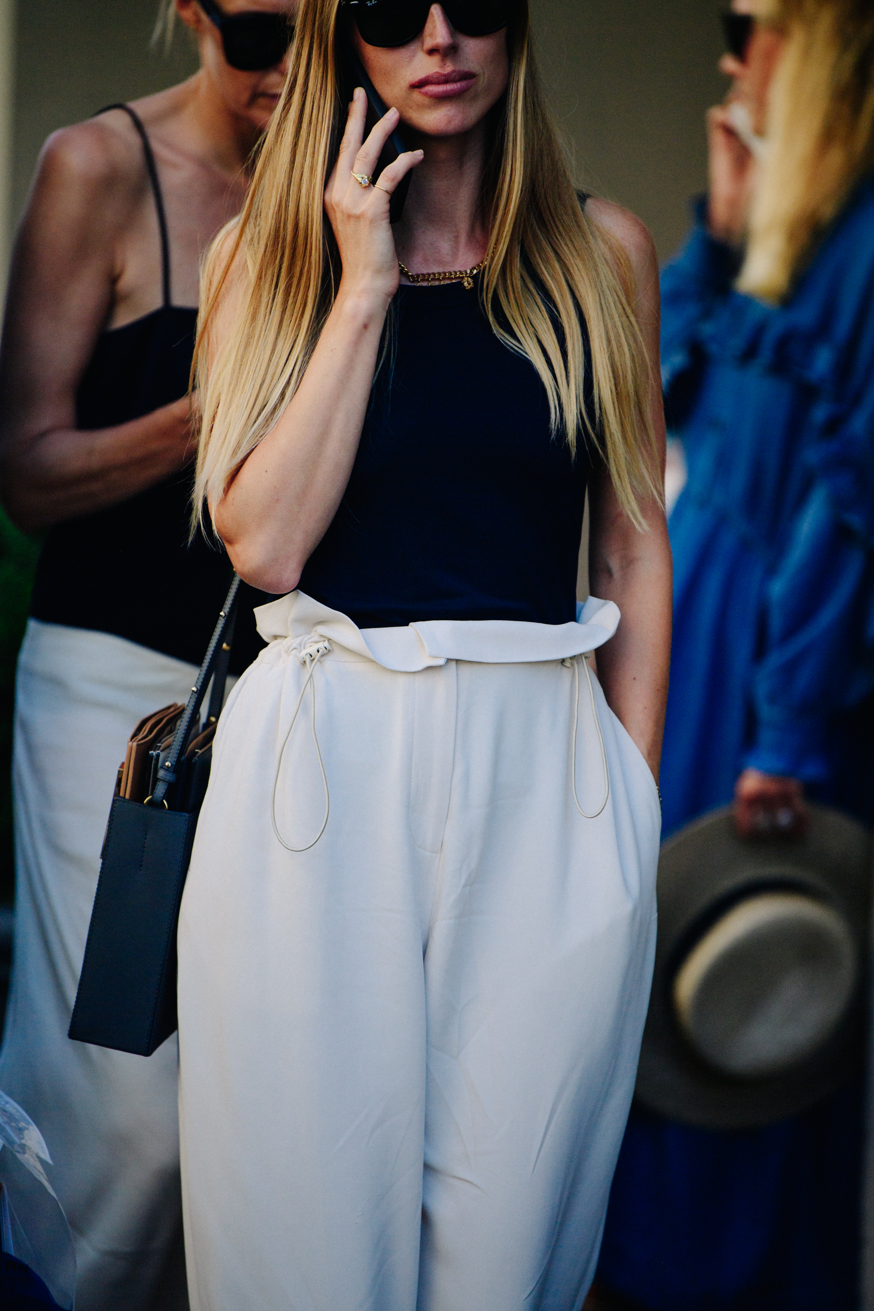 Woman wearing white pants