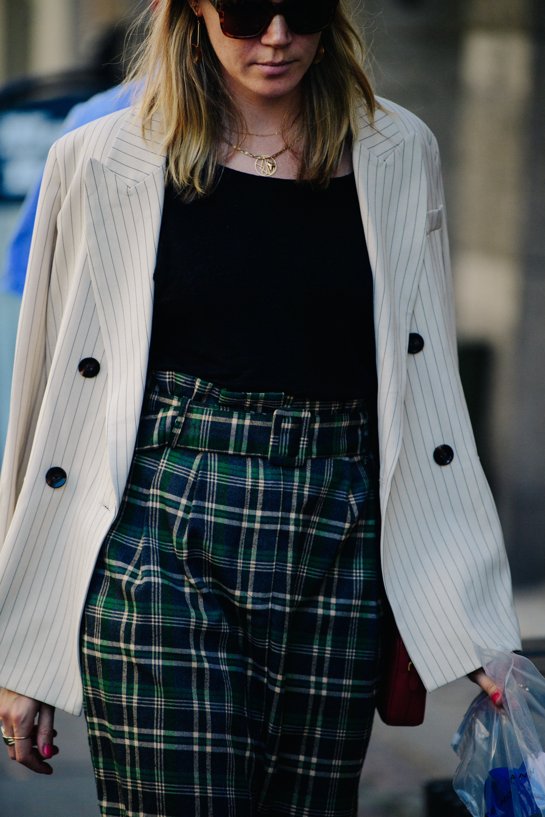 Woman wearing green check pants