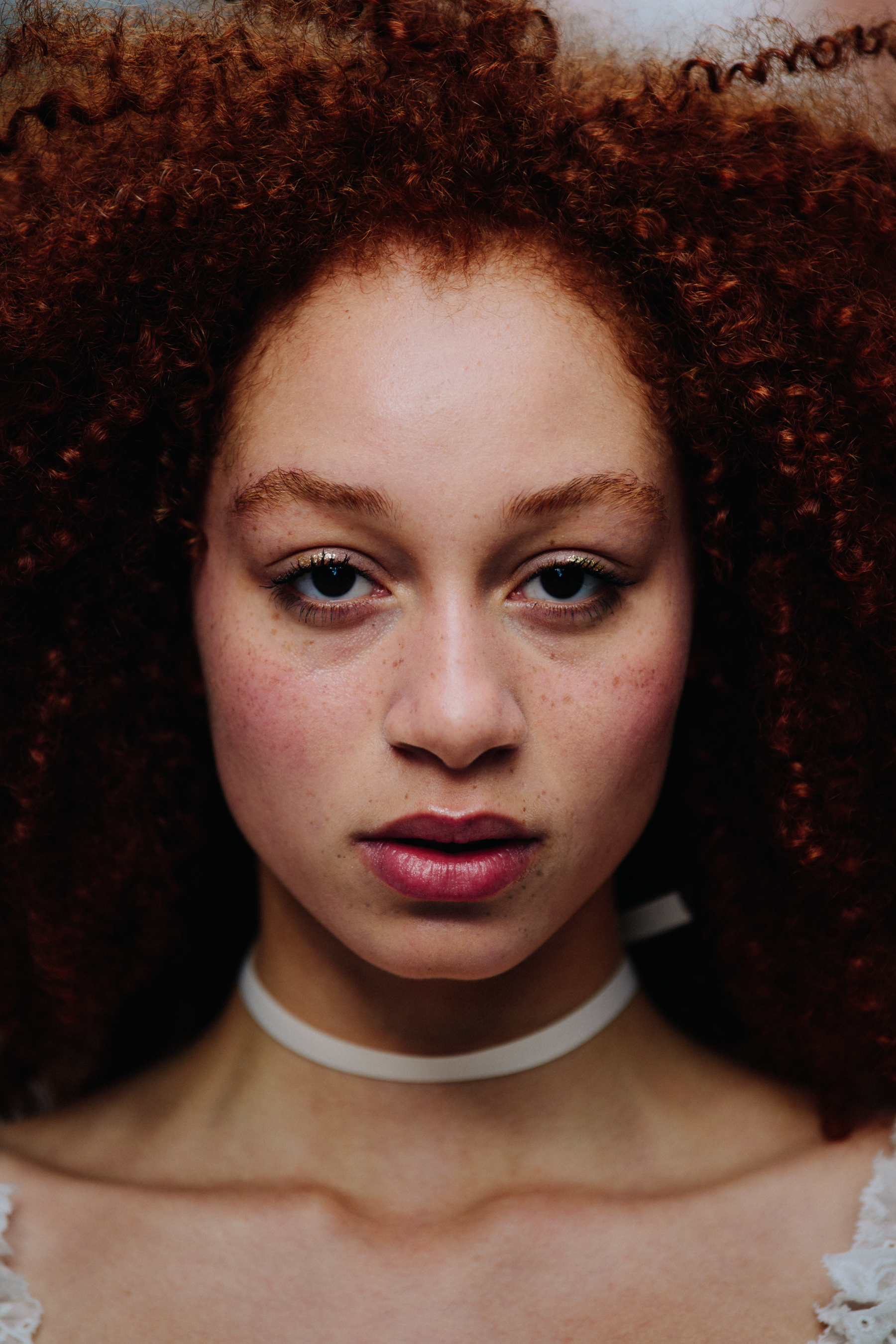 Portrait of model with curly red hair