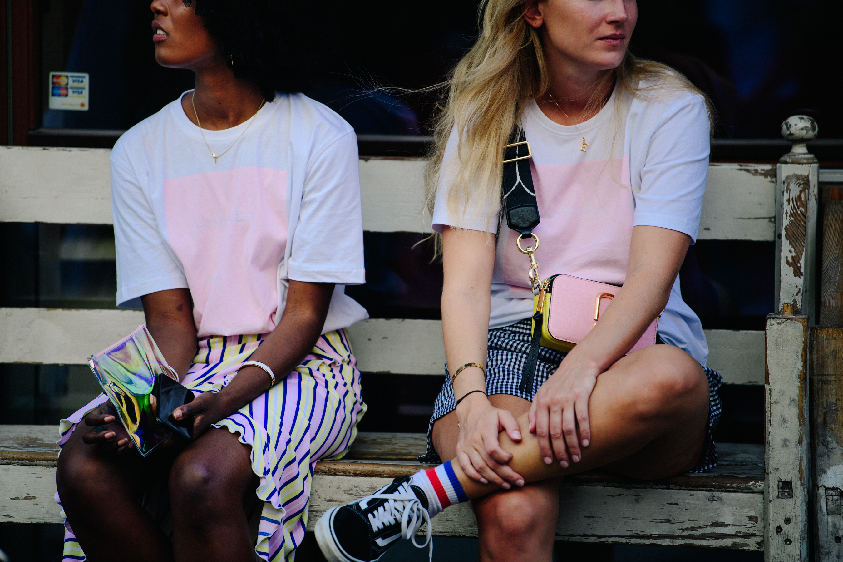 Two women wearing pink tee shirts