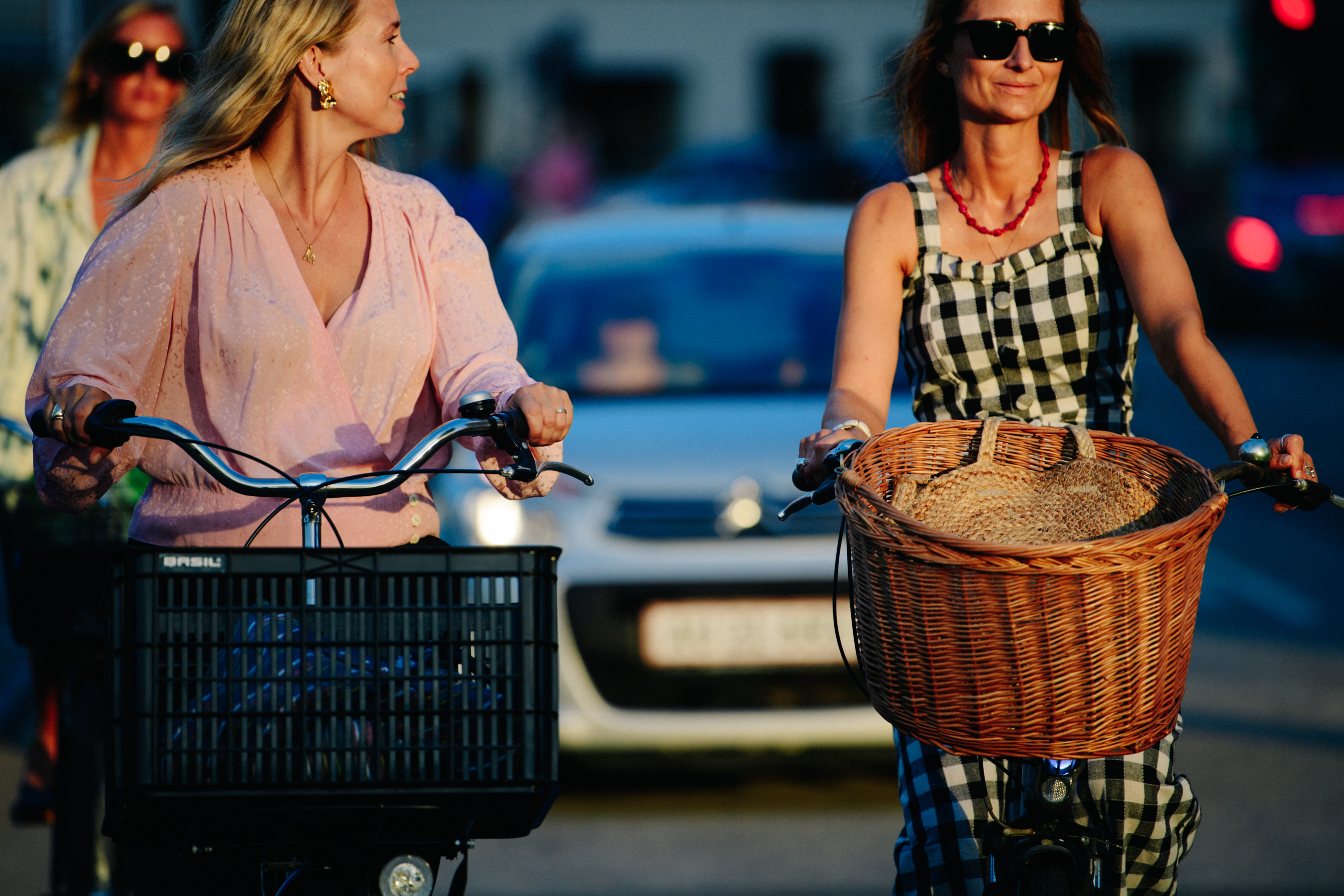 Two women riding bikes