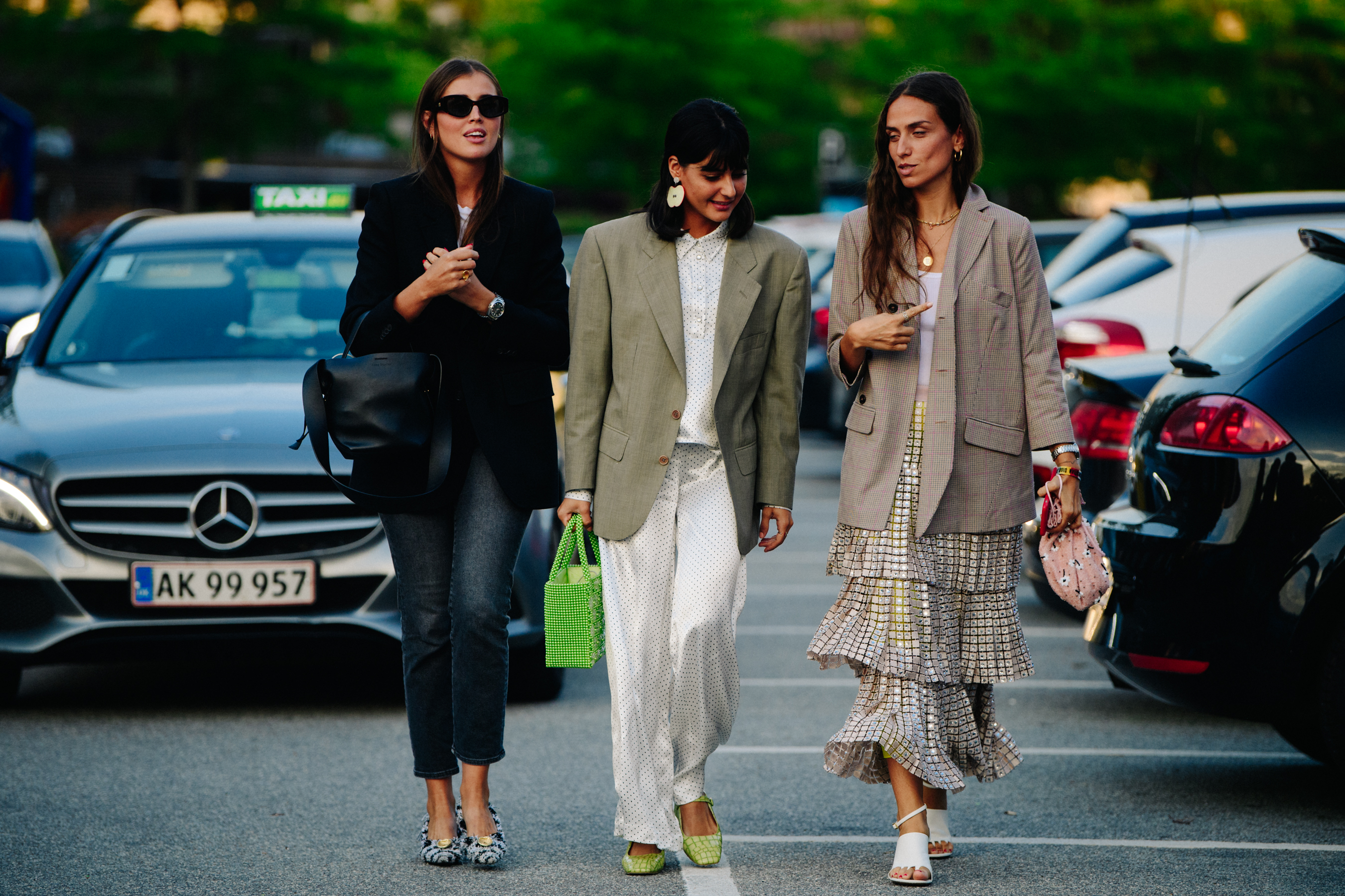 Three bloggers wearing formal jackets