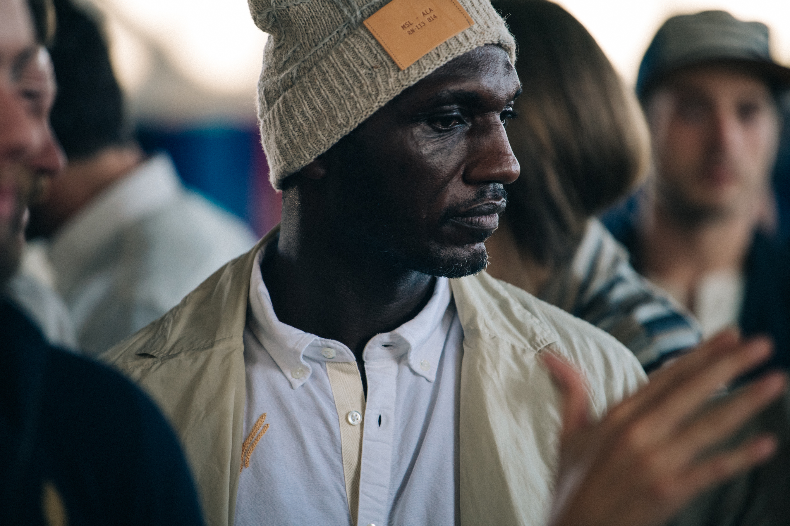 Model wearing hat backstage at Billy Reid