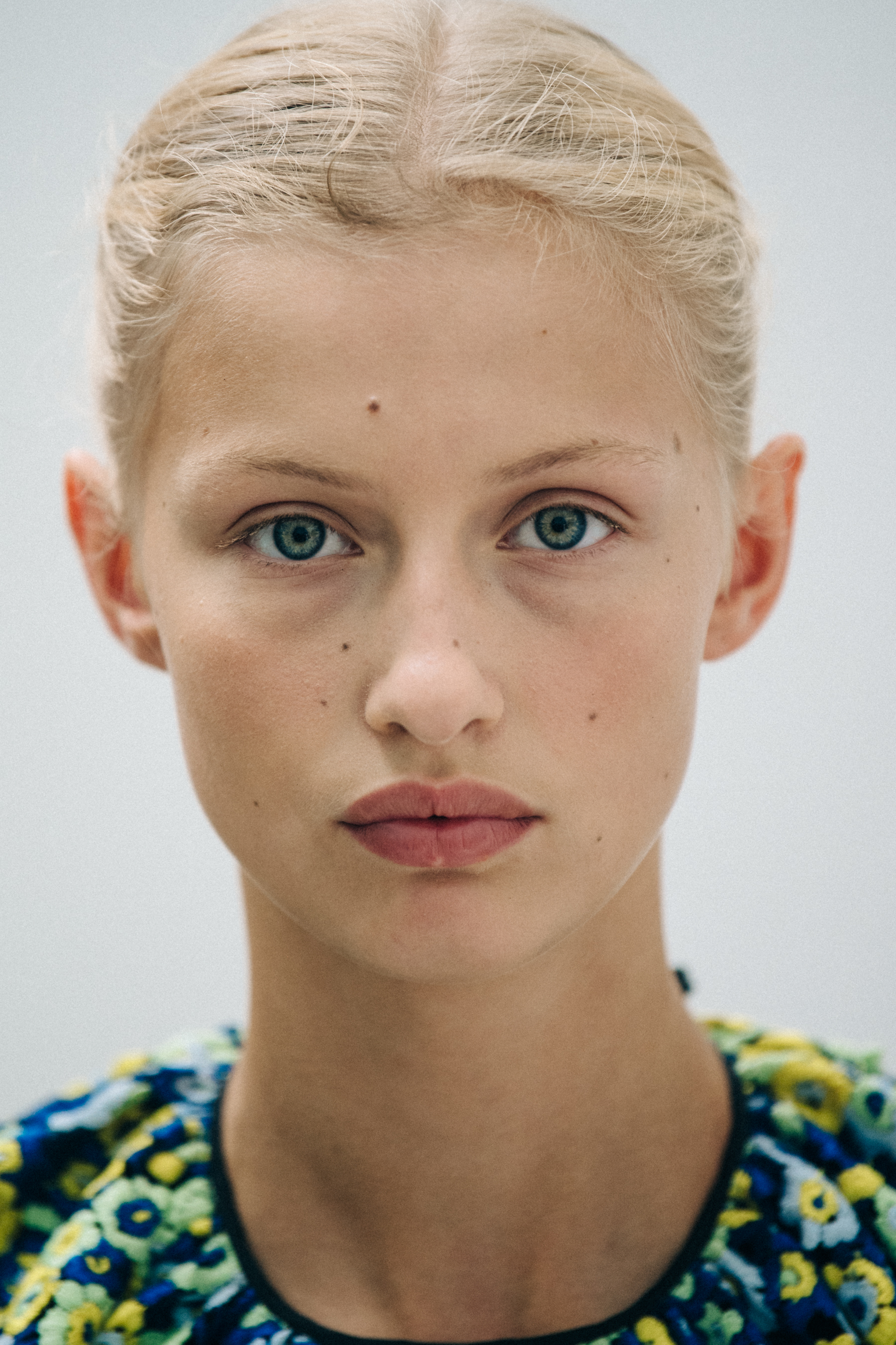 Portrait of model with blonde hair at Cecilie Bahnsen