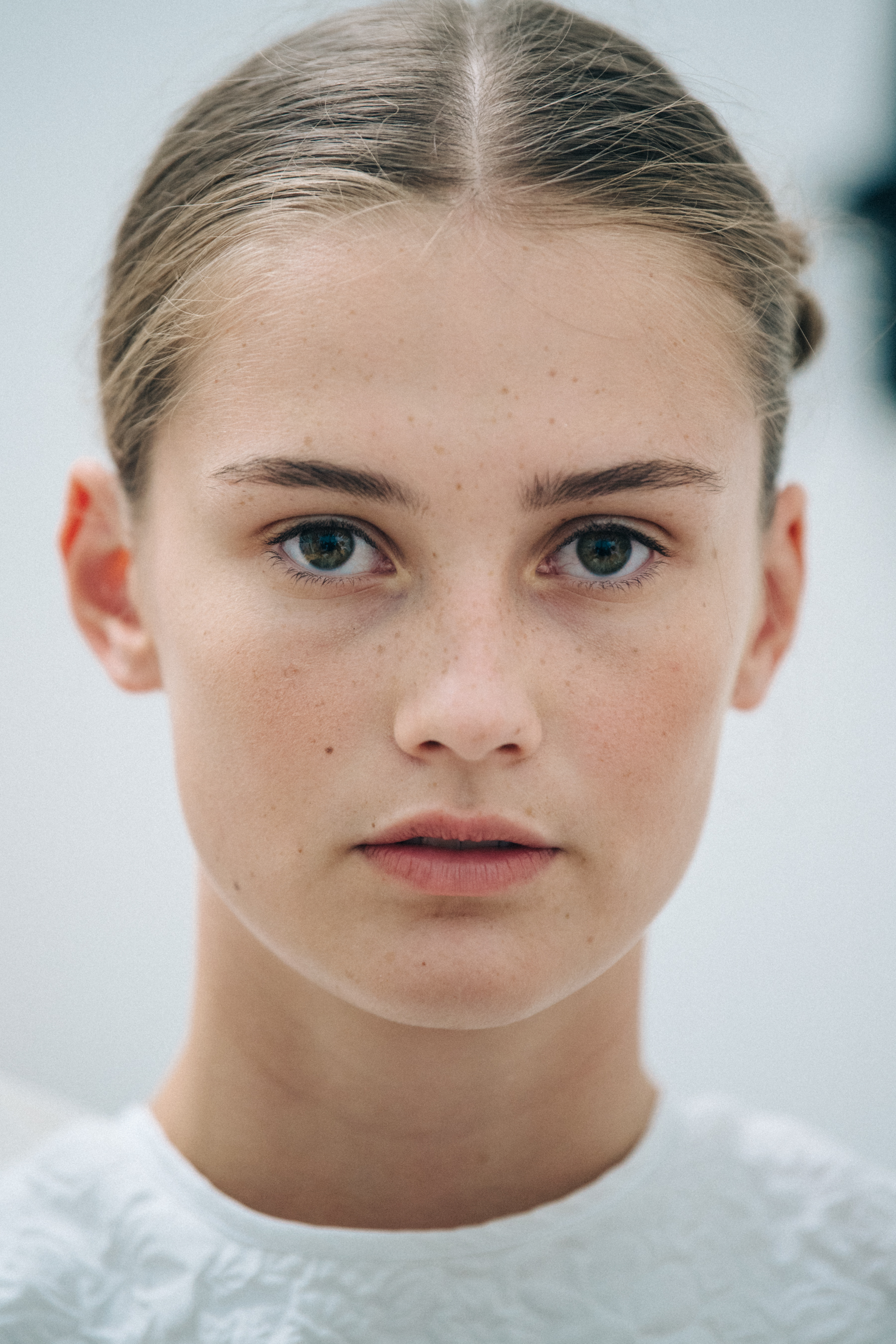 Portrait of model with blonde hair at Cecilie Bahnsen