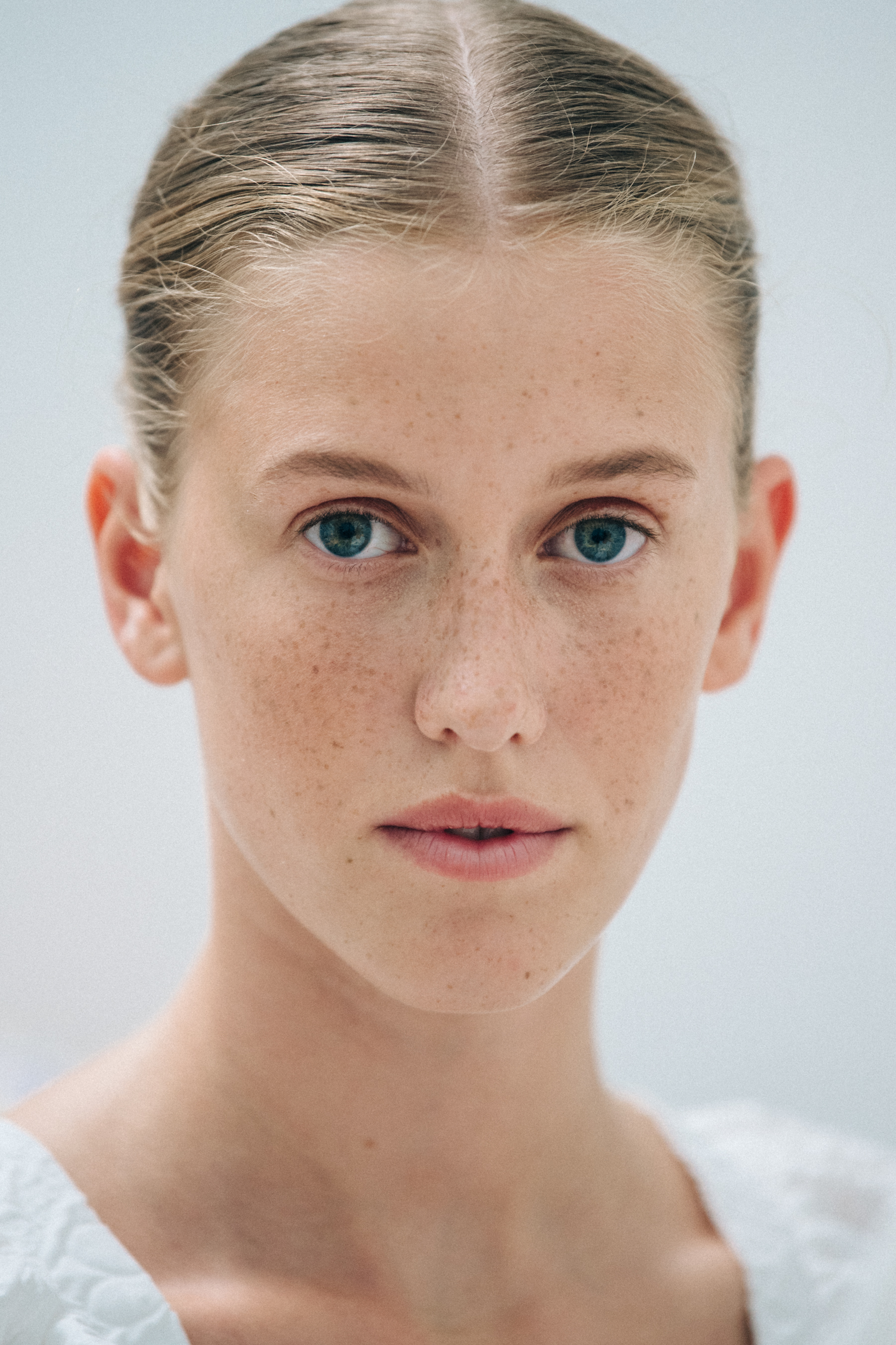 Portrait of model with blonde hair at Cecilie Bahnsen