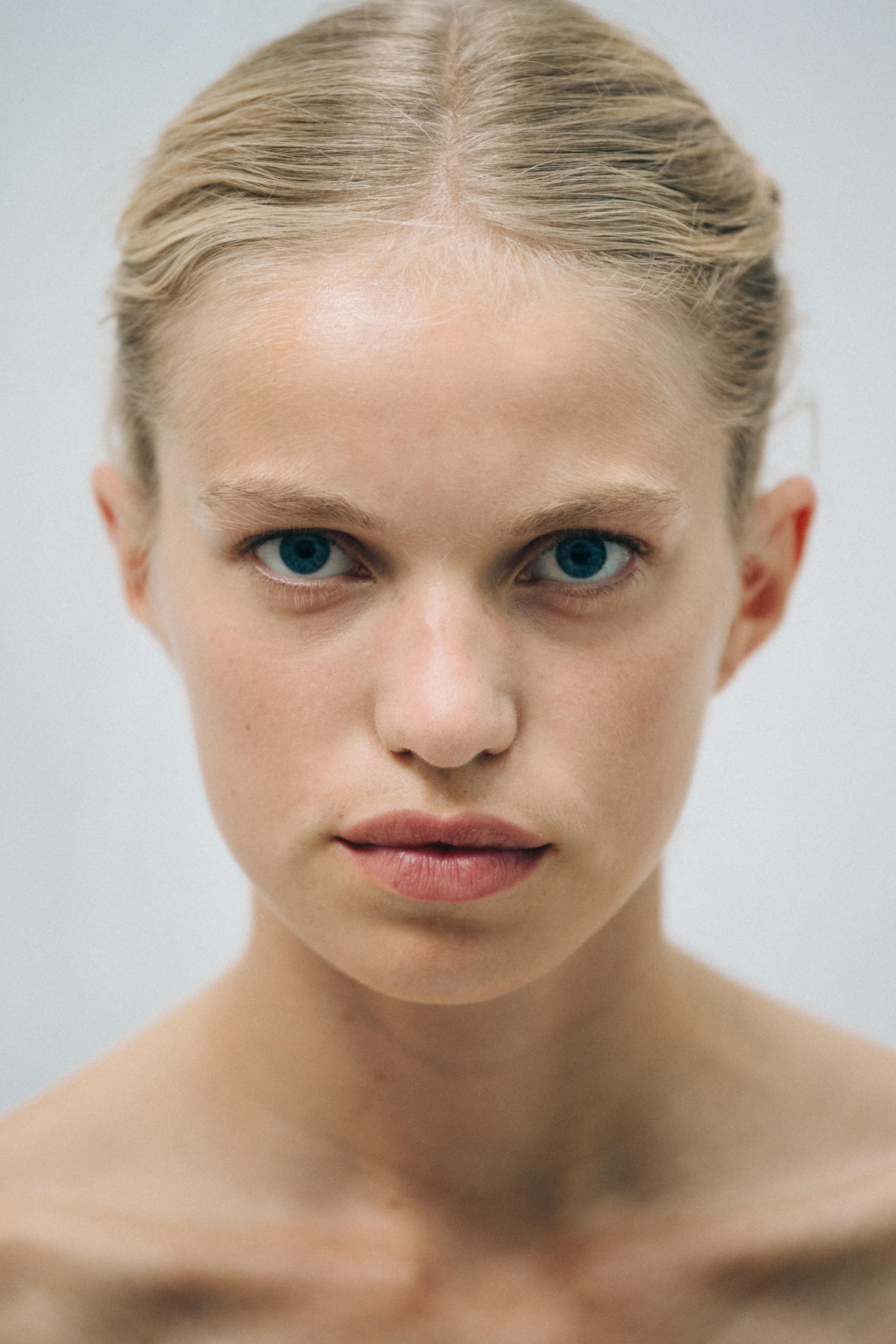 Portrait of model with blonde hair at Cecilie Bahnsen
