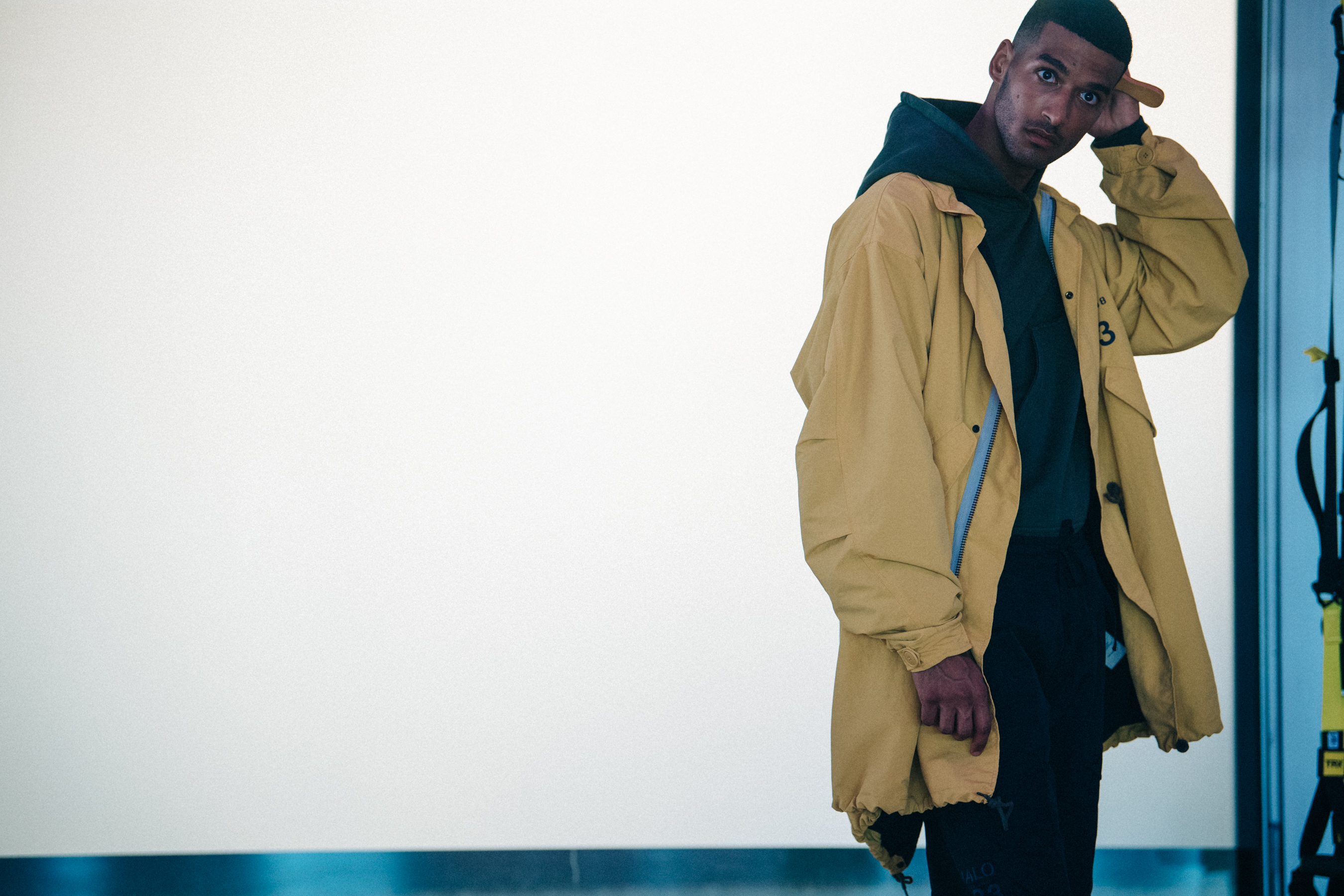 Model wearing yellow coach jacket