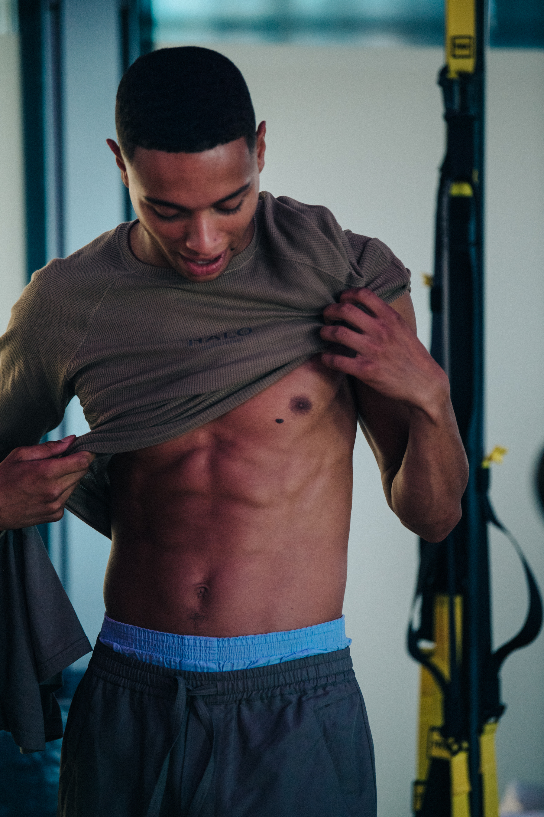 Muscular topless models backstage at HALO