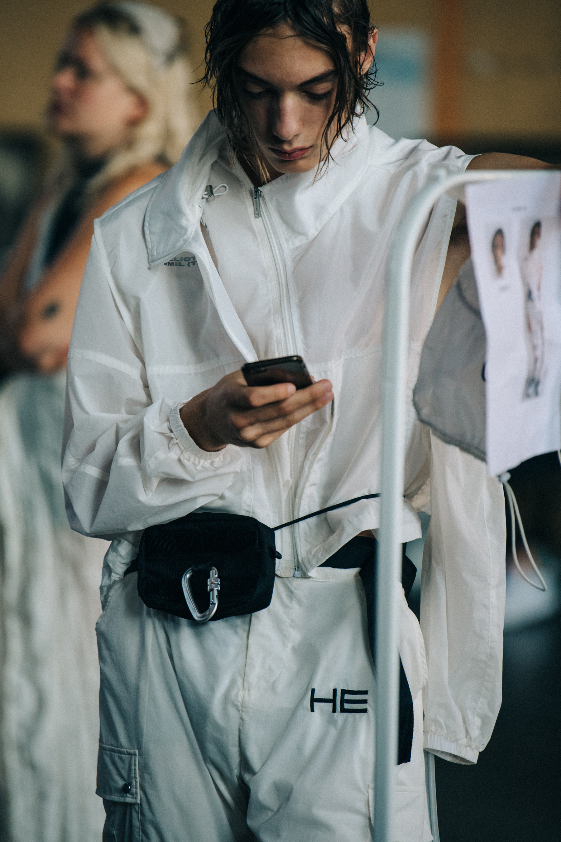 Model wearing white outfit at Heliot Emil