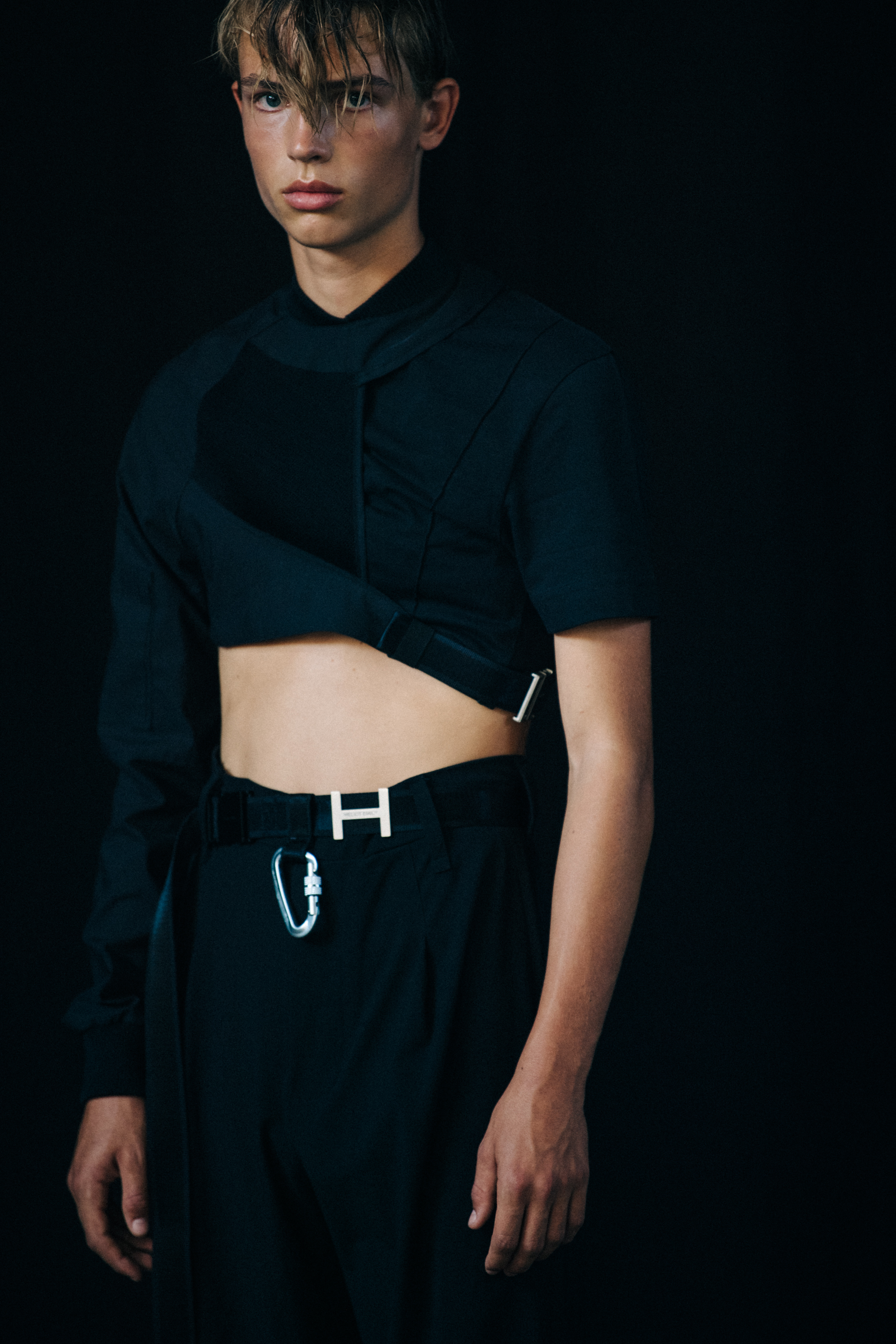 Model wearing black outfit at Heliot Emil