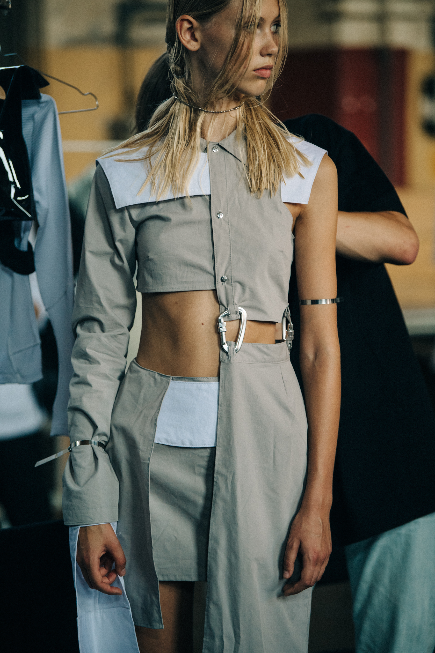 Model wearing white outfit at Heliot Emil