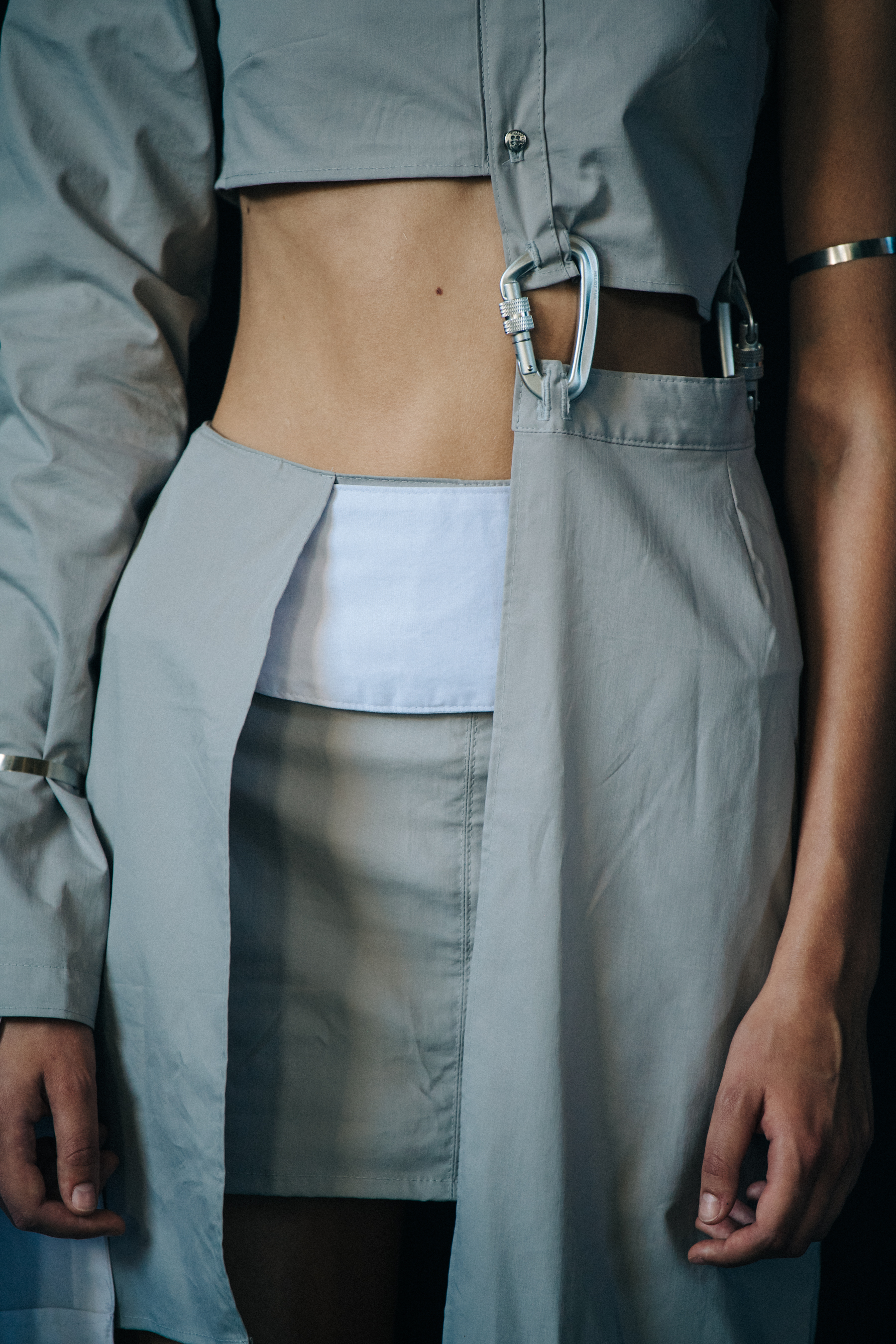 Model wearing white outfit at Heliot Emil